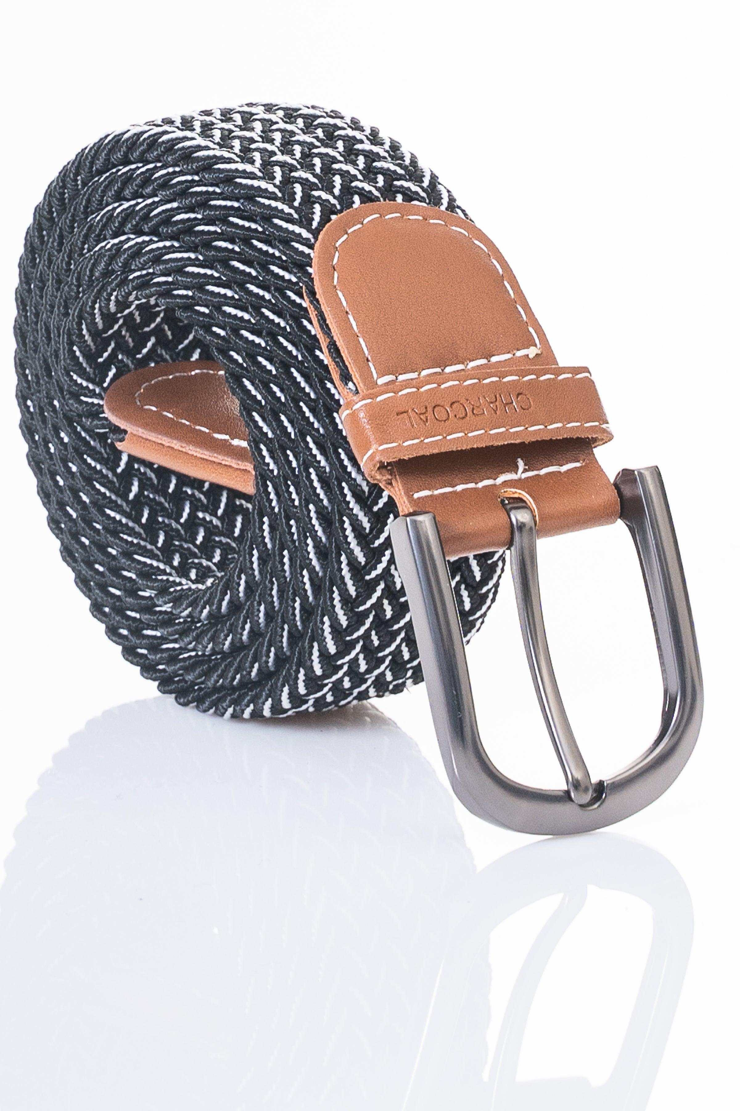 Textured woven belt with dark pattern, tan leather tip, and silver metal buckle.