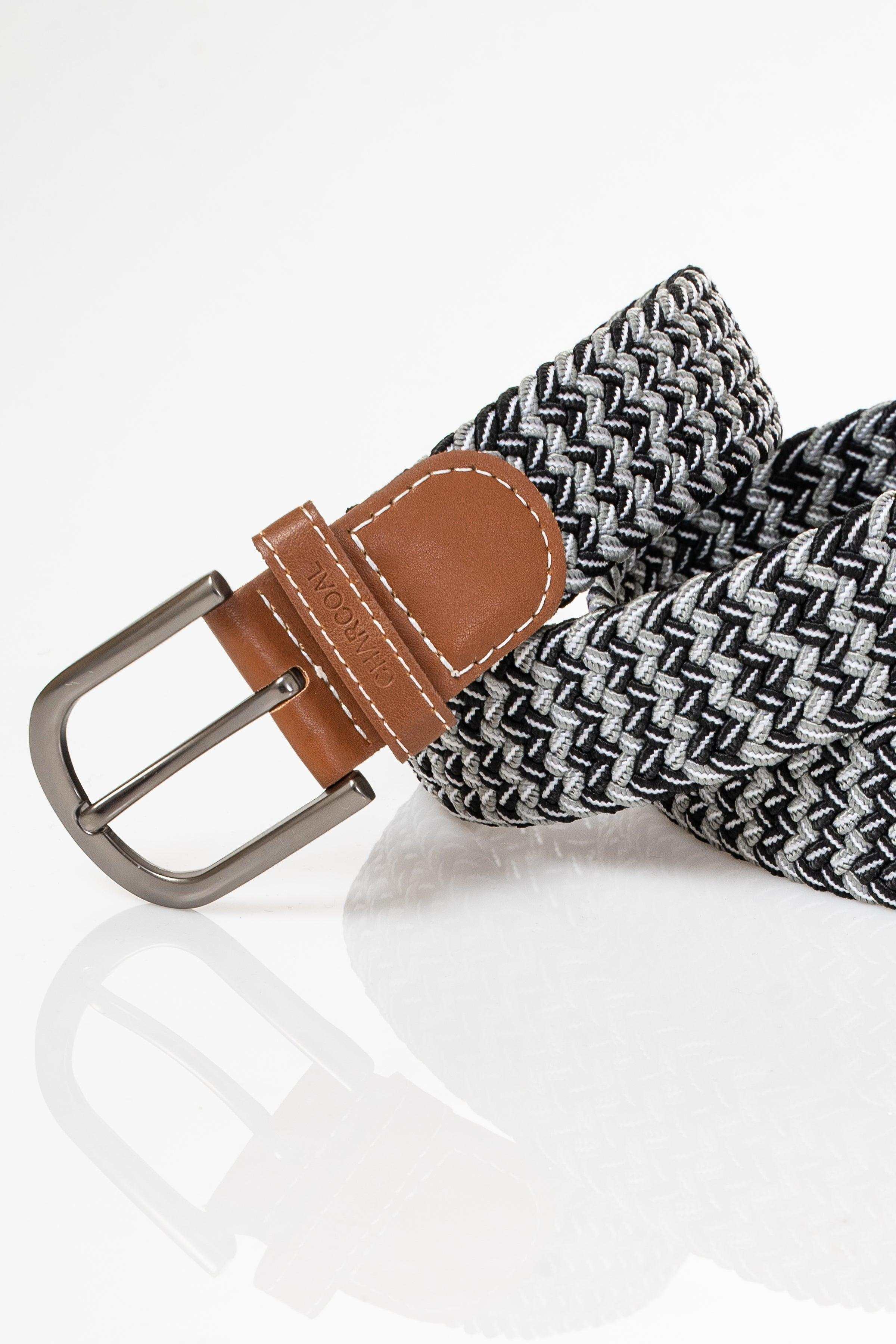 Woven casual belt close-up, brown leather keeper and metal buckle on striped weave
