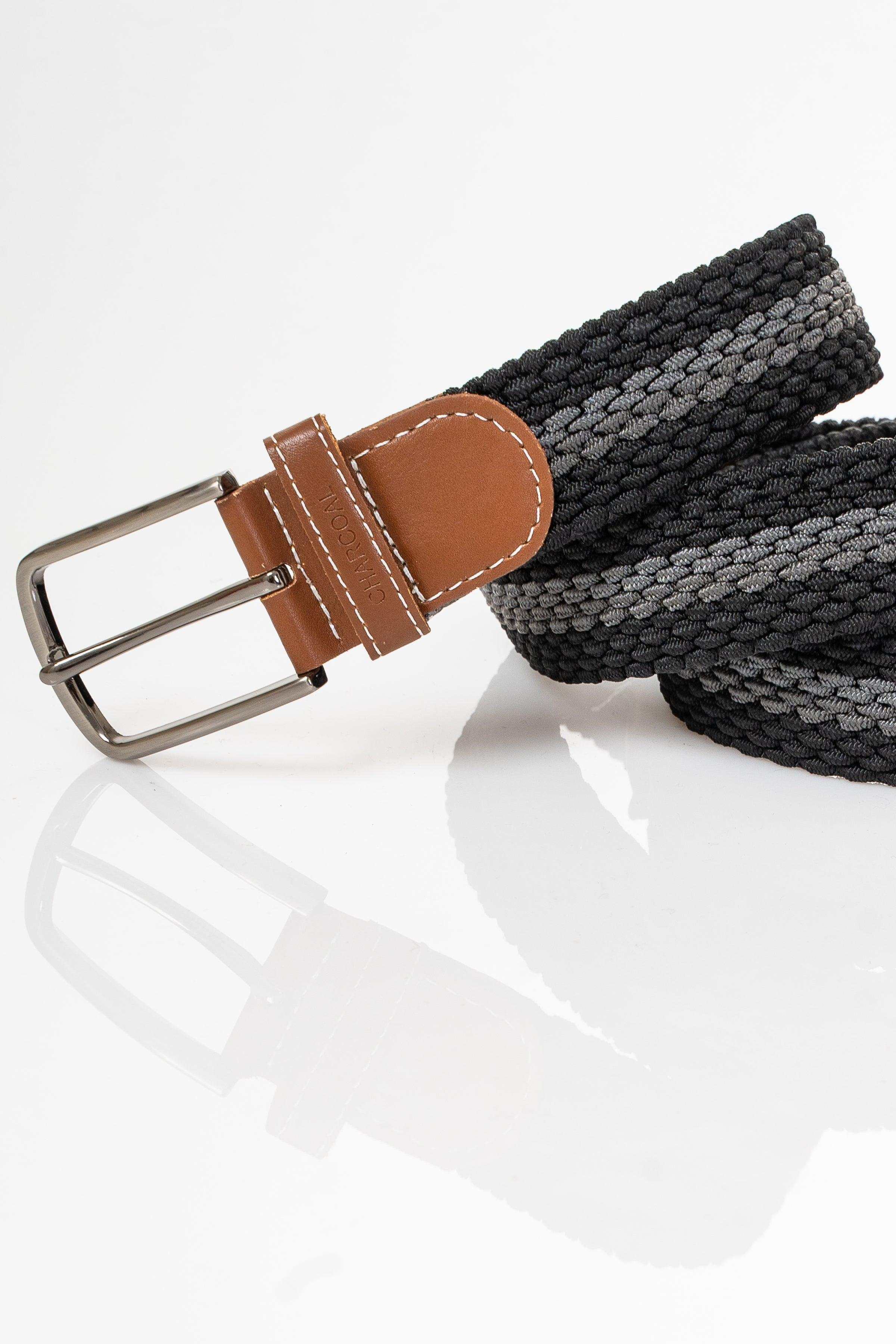 Black woven belt with tan leather center tab and silver rectangular buckle