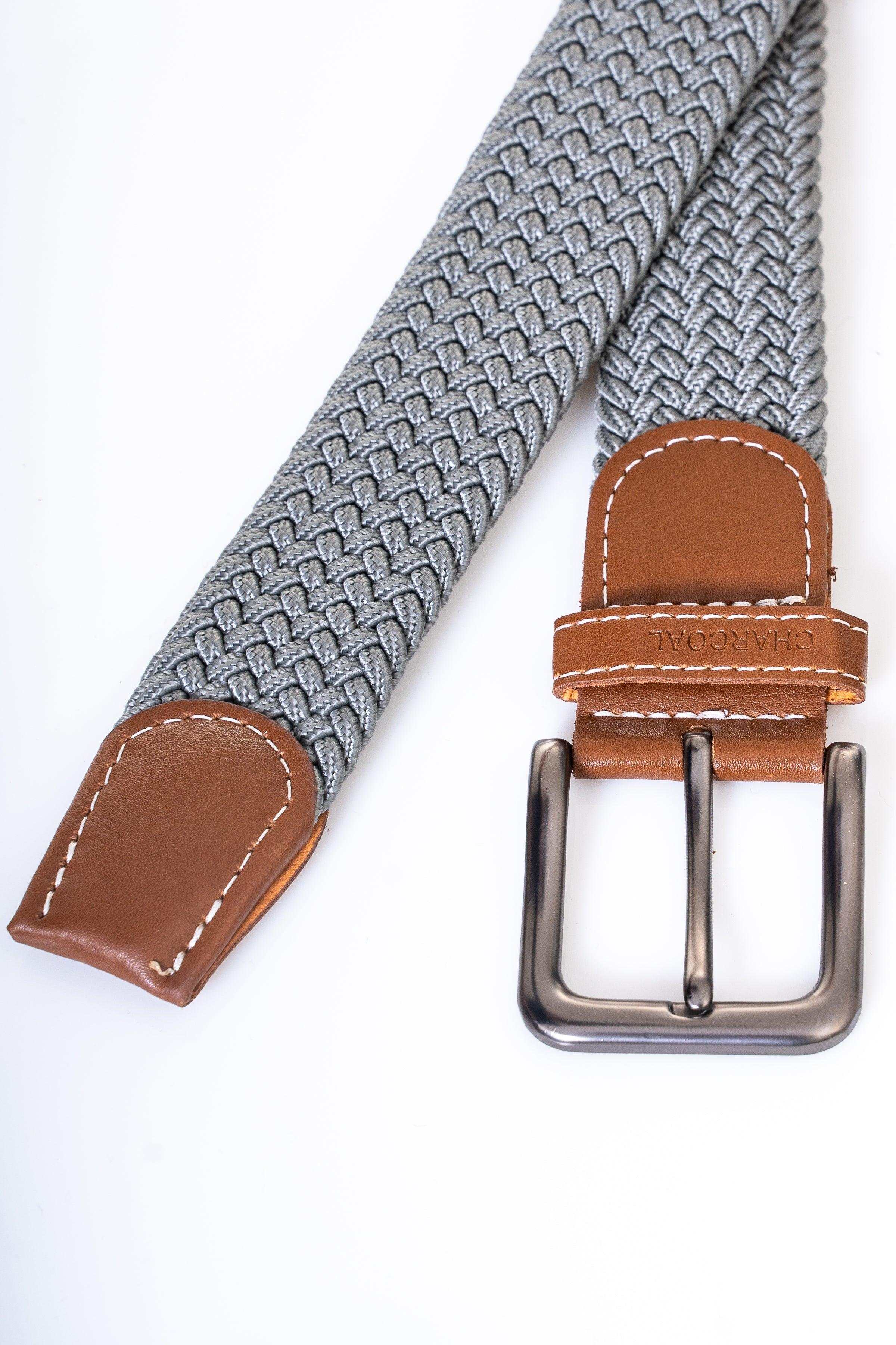 Woven casual belt with dark gray woven strap, brown leather keeper patches, and silver buckle.