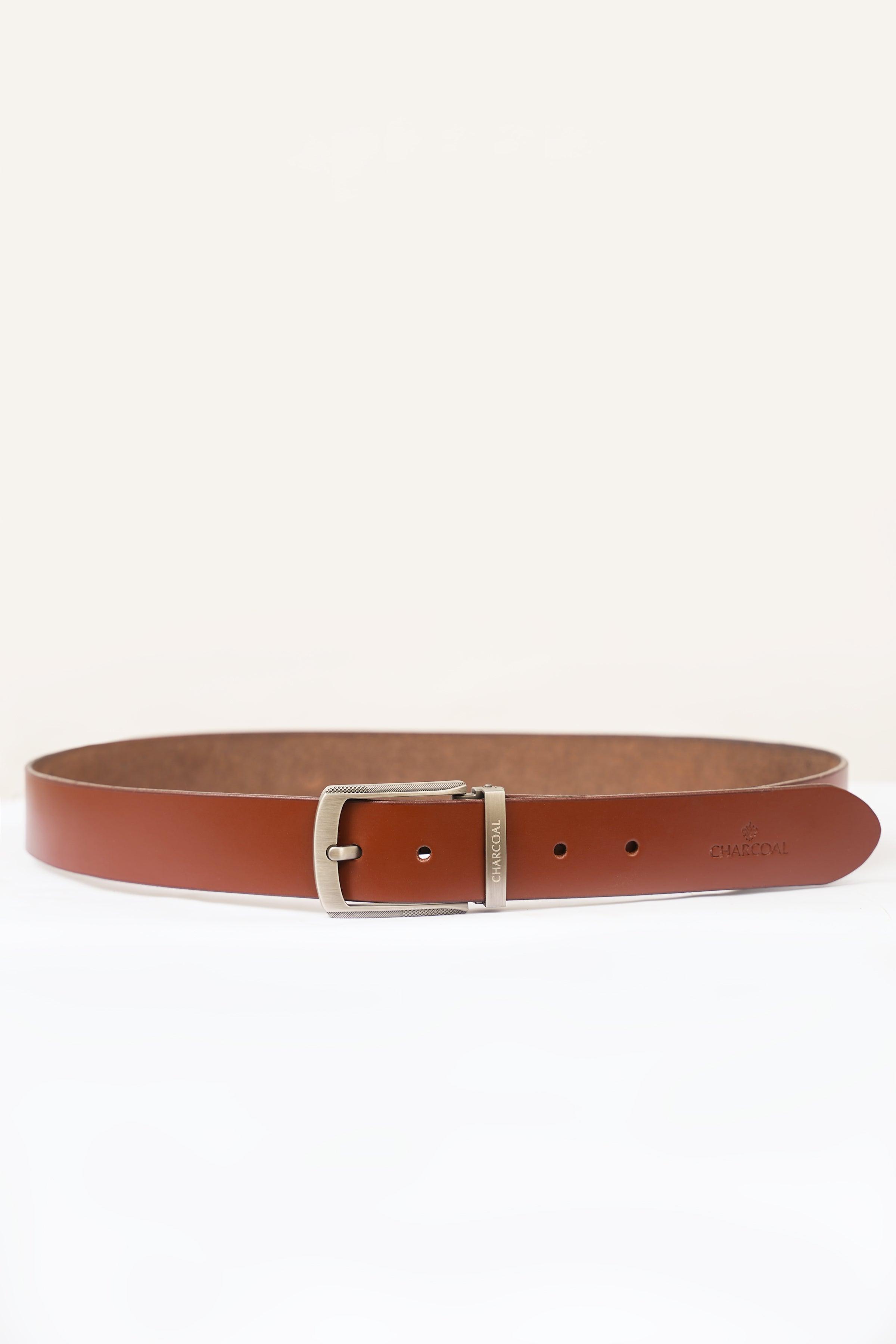 Brown leather belt with square silver buckle and multiple punch holes, flat lay