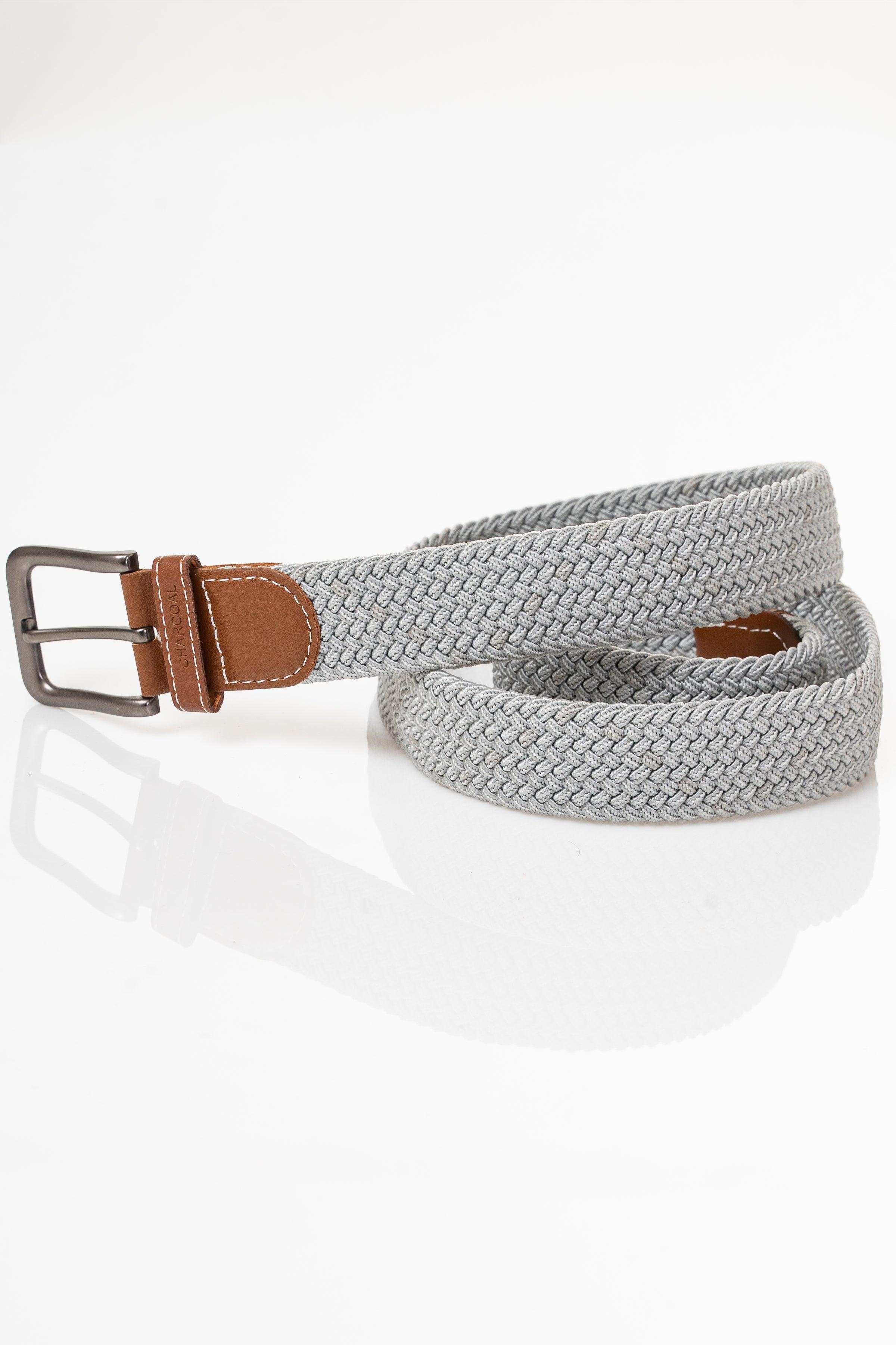 Gray woven casual belt with brown leather tab and silver buckle, coiled