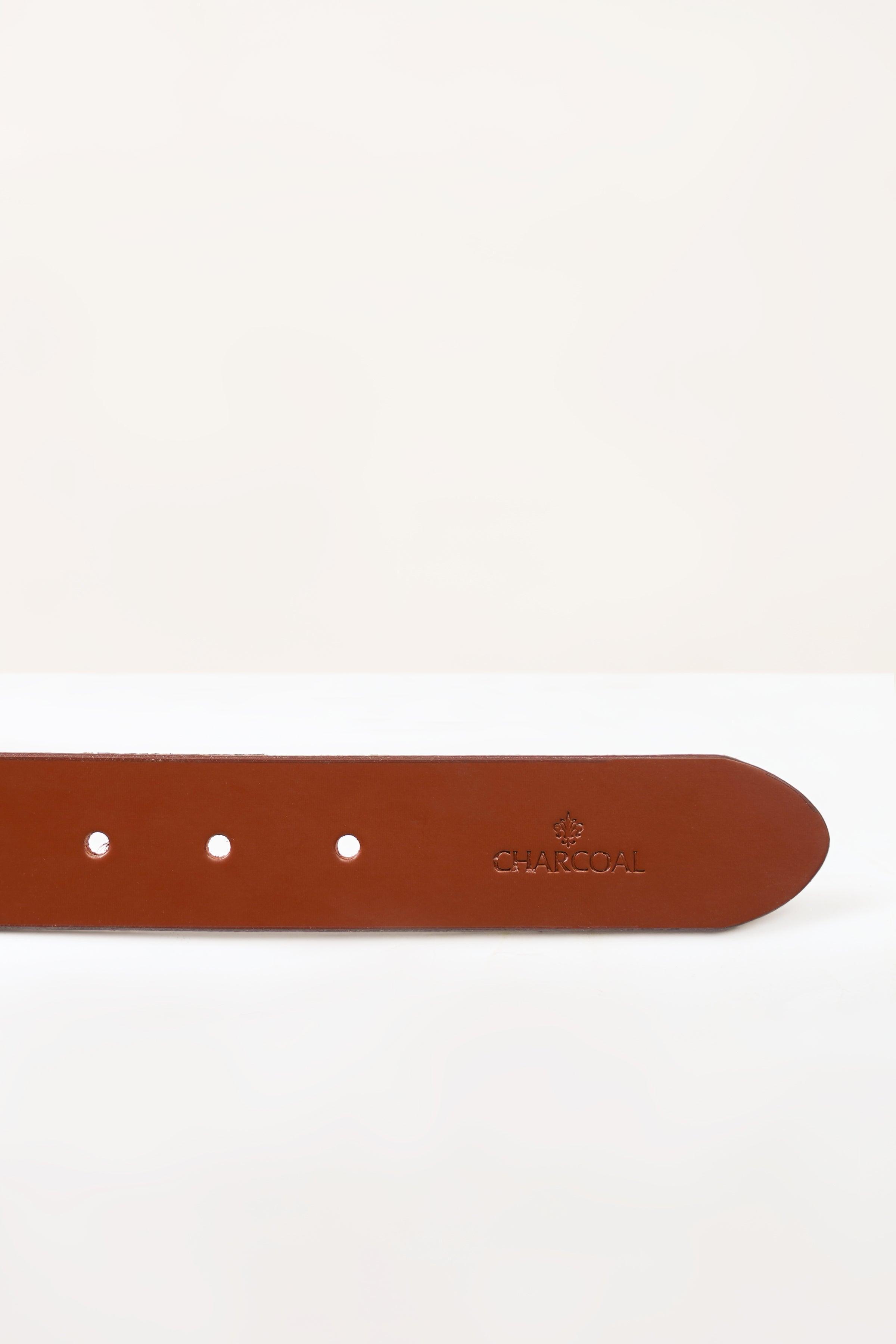 Brown belt underside with three adjustment holes and stamped logo, close-up