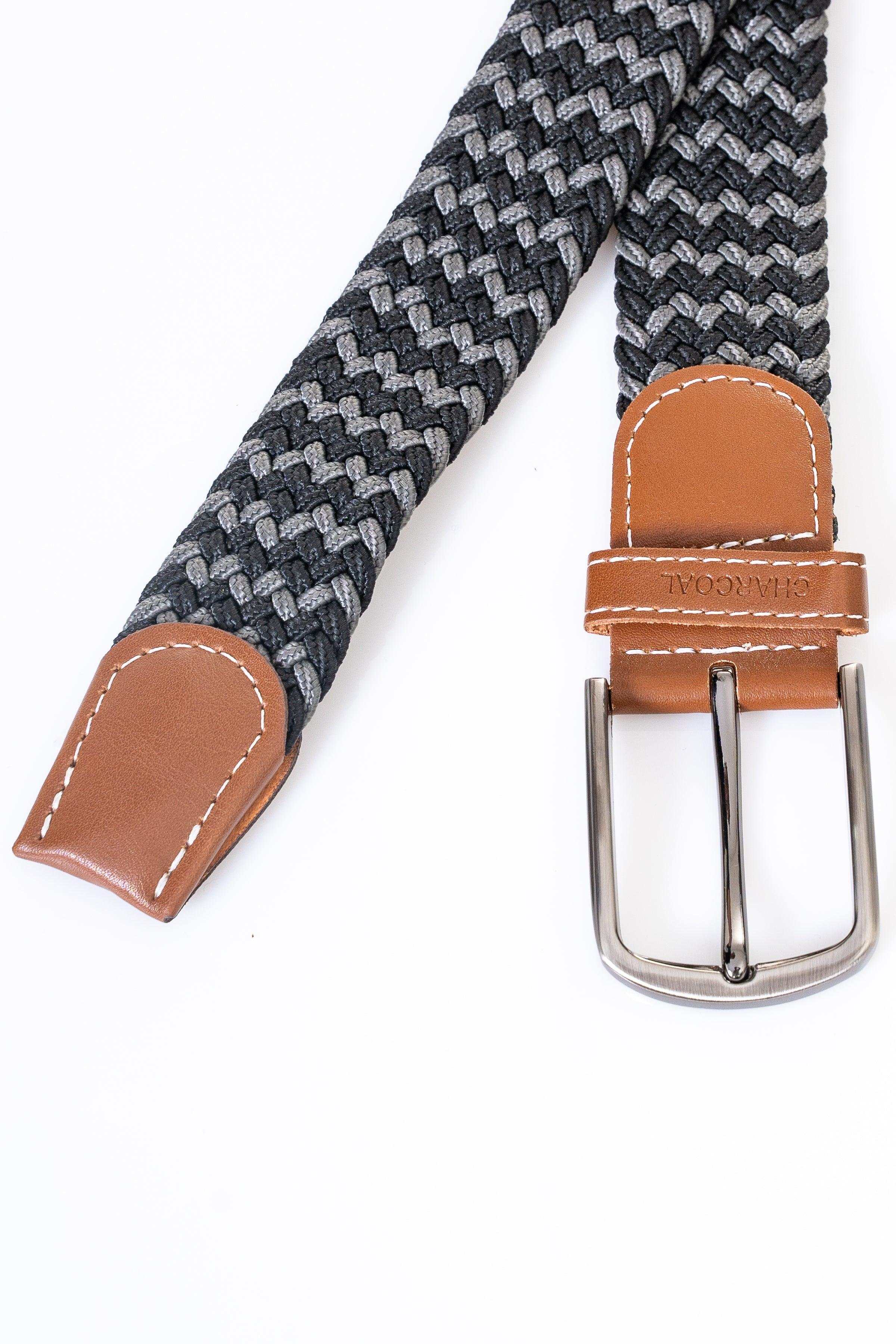 Woven belt with dark gray check pattern, tan leather ends and silver buckle.