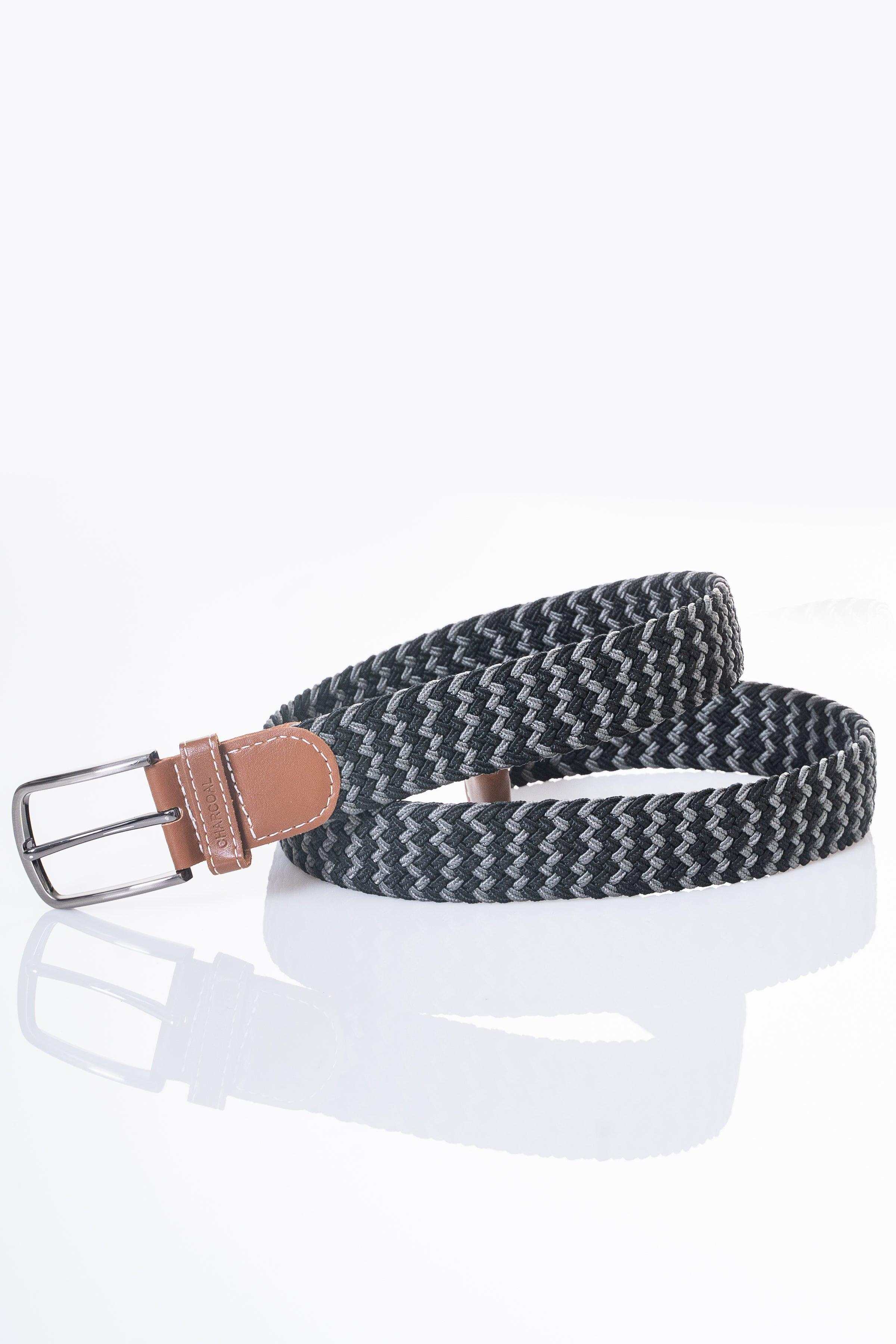 Woven belt with dark gray zigzag pattern, tan leather end and silver buckle.