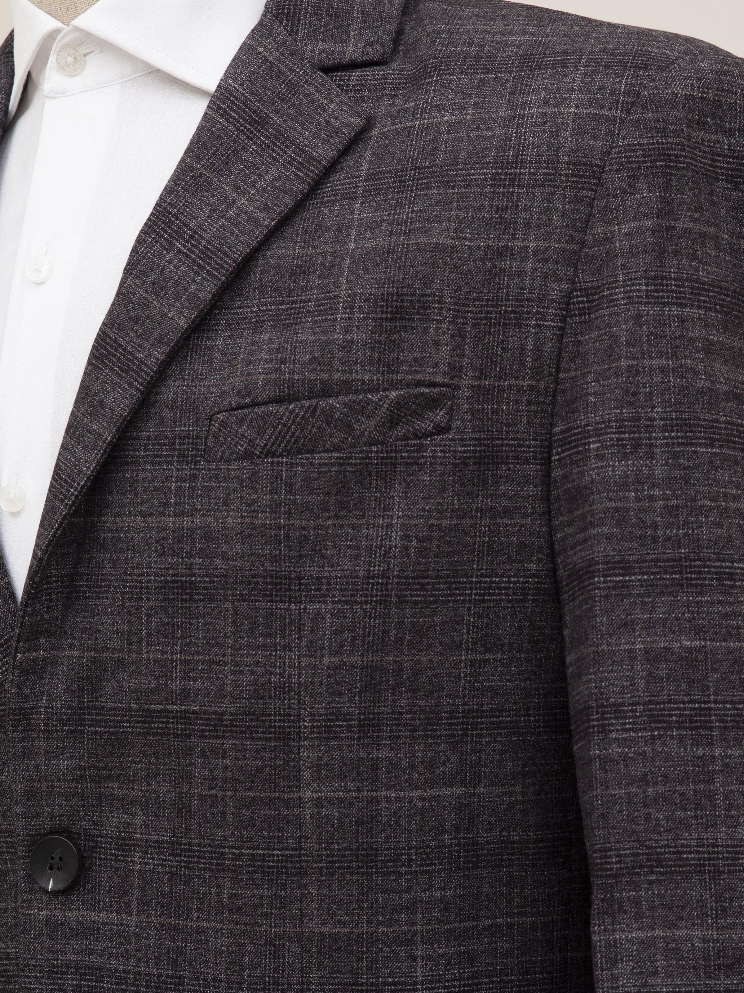 Dark grey coat shoulder and chest area with flap pocket and textured weave
