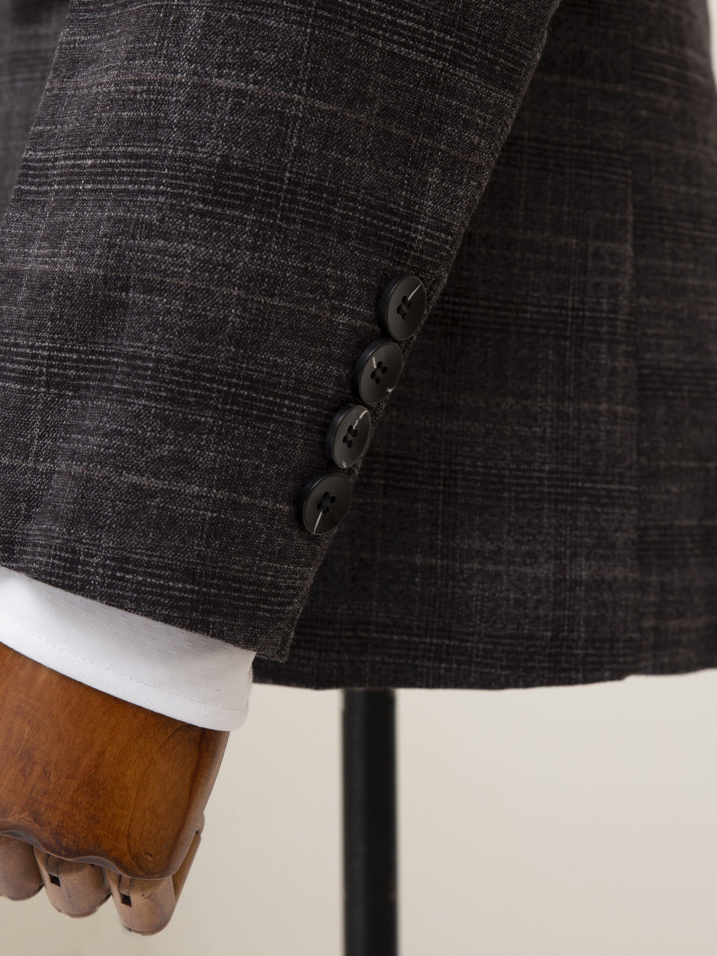 Dark grey blazer-style cuff and double-button front detail with white shirt cuff