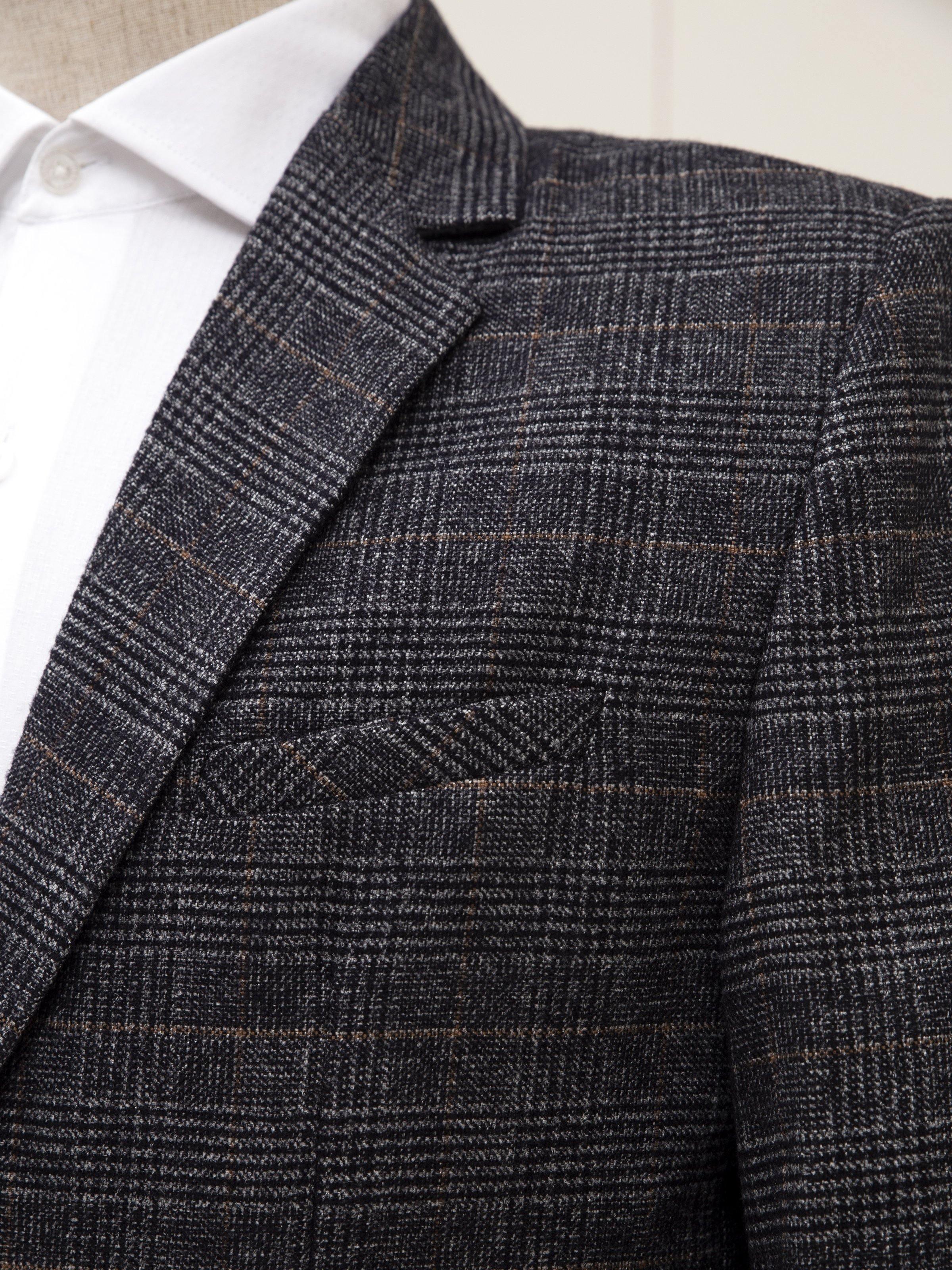 Grey plaid blazer-style jacket with white shirt collar peeking