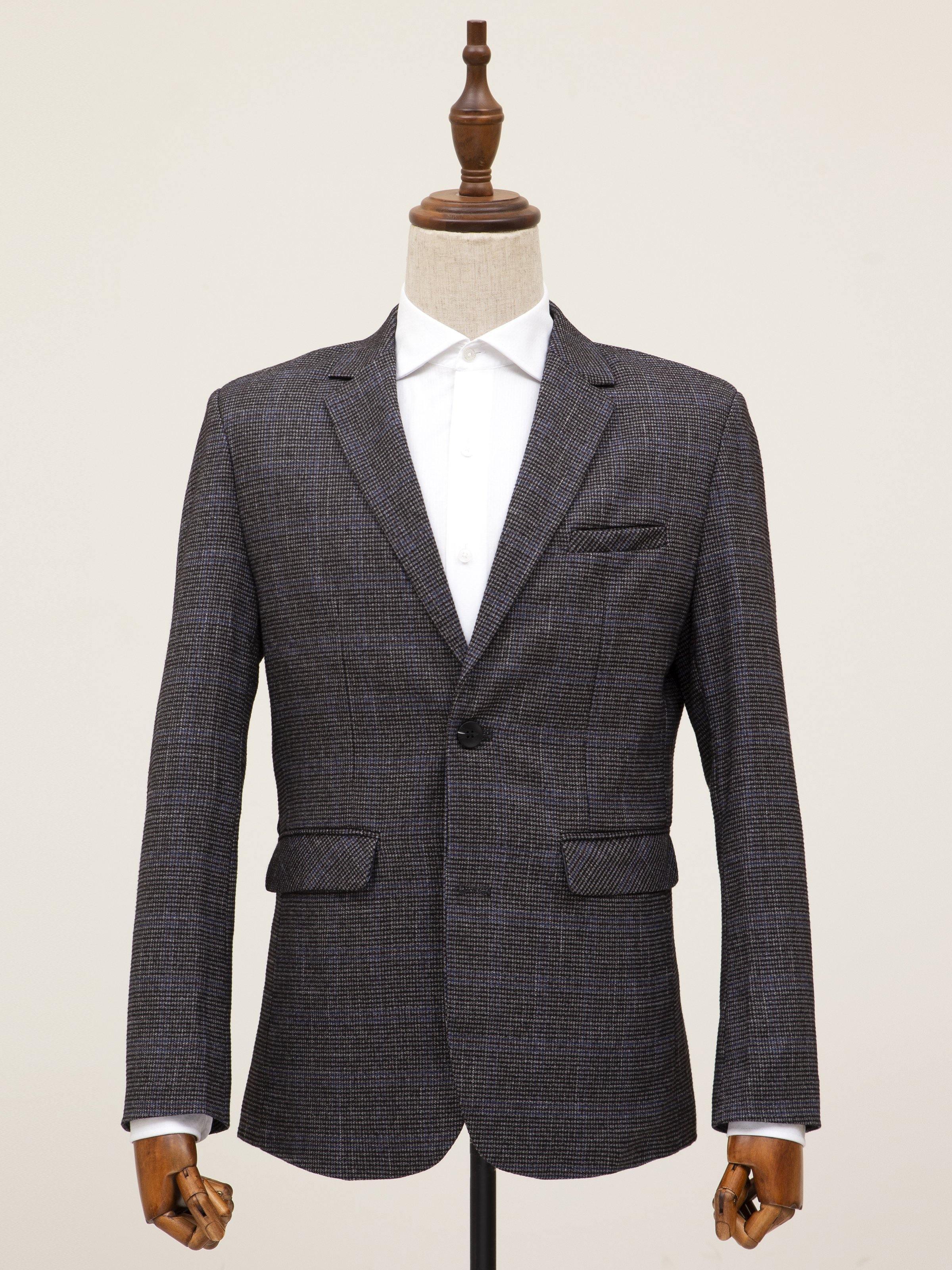 Grey two-button casual coat on mannequin with notch lapels and flap pockets