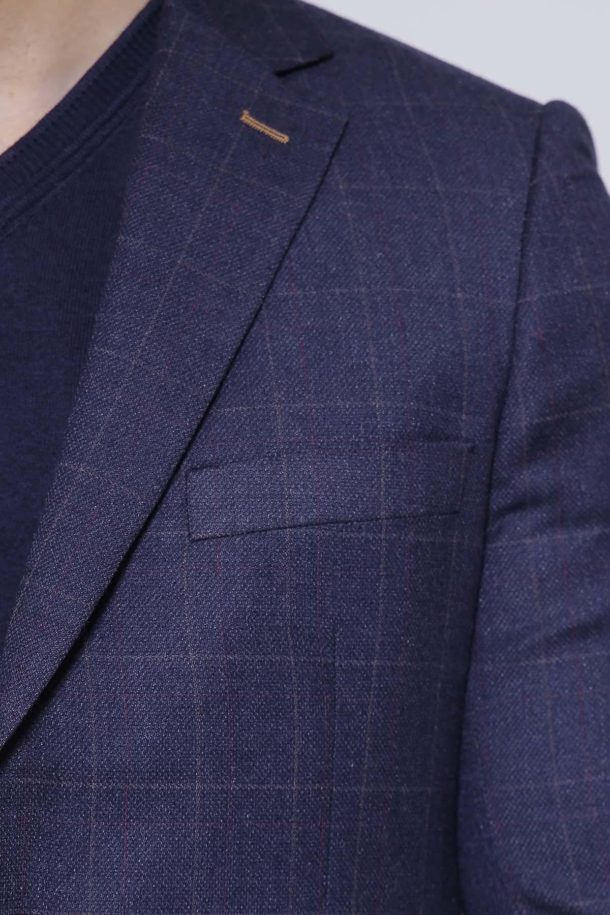 Navy coat lapel and chest pocket detail, single-breasted