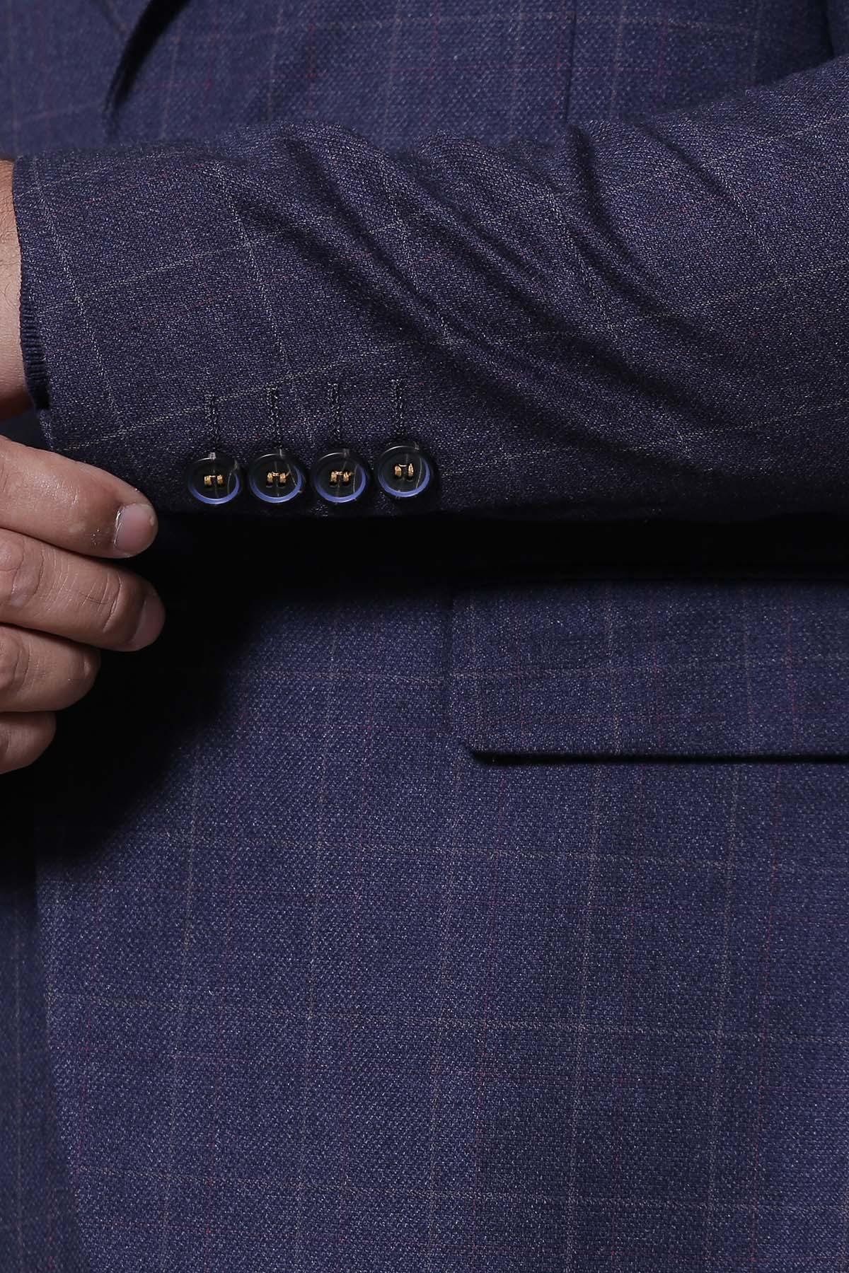 Navy coat front button close-up with side welt pocket