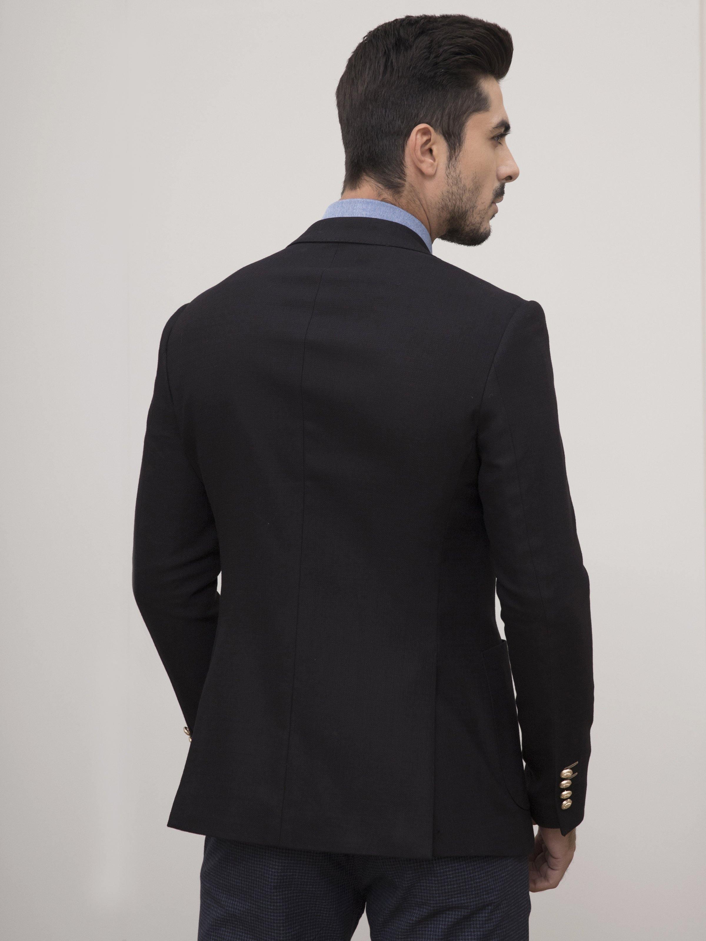 Black slim-fit coat back view with notch collar and gold cuff buttons.