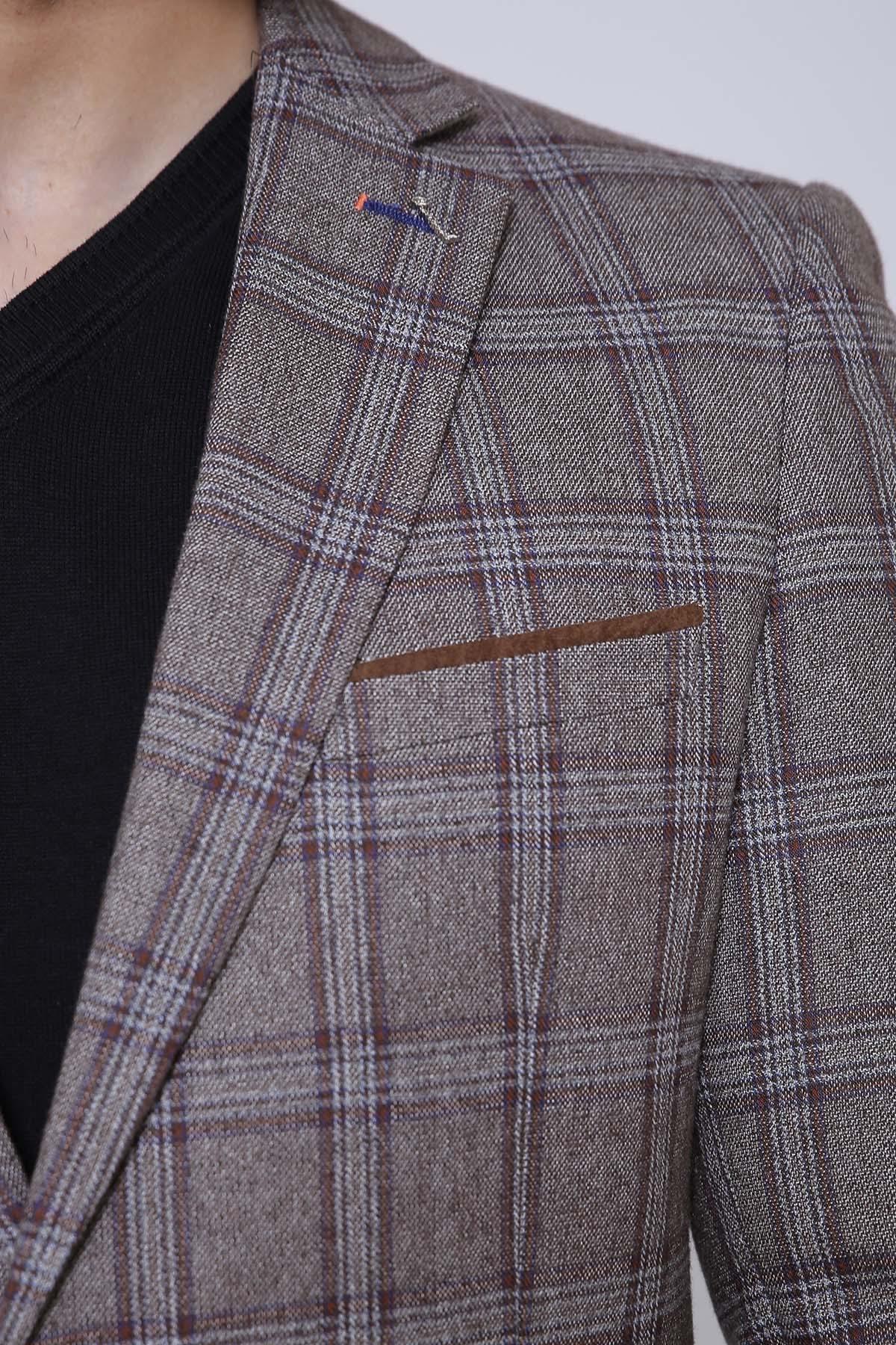 Plaid slim-fit coat detail: chest pocket flap and textured shoulder seam.