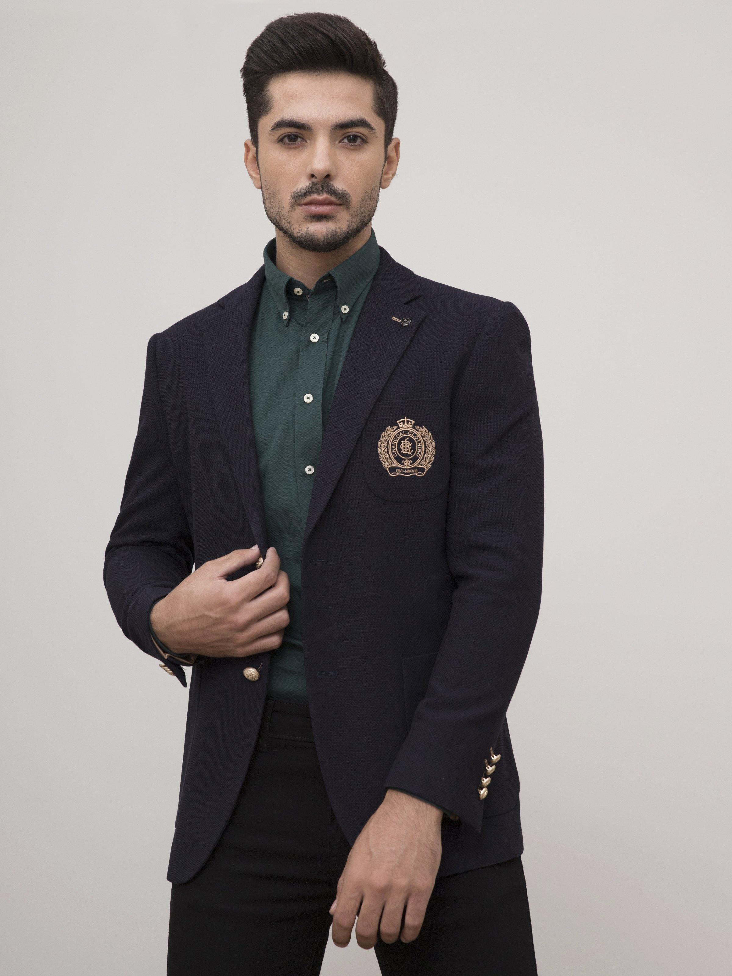 Navy slim-fit casual coat with notch lapels, front buttons, and crest chest pocket