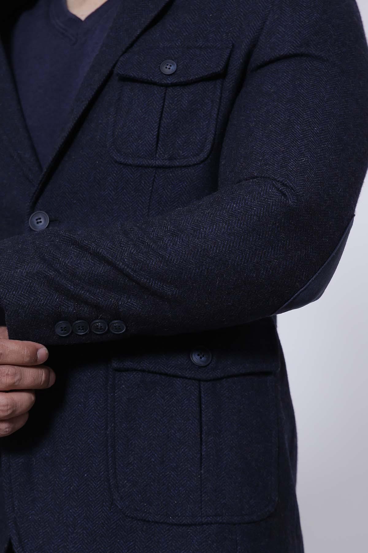 Navy slim-fit casual coat with side flap pockets and sleeve button detail