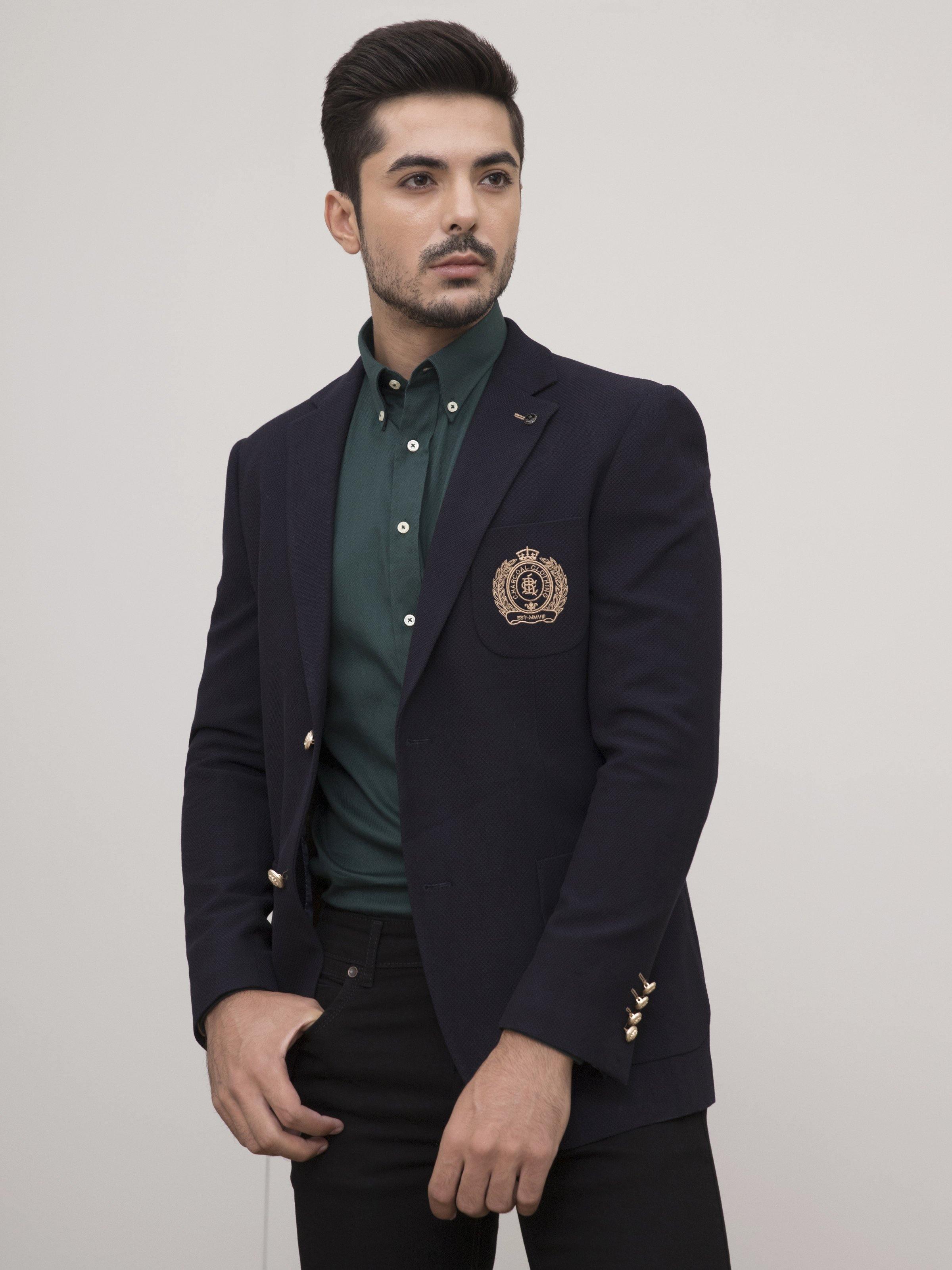 Navy slim-fit casual coat with crest patch, flap pocket, and buttoned cuffs