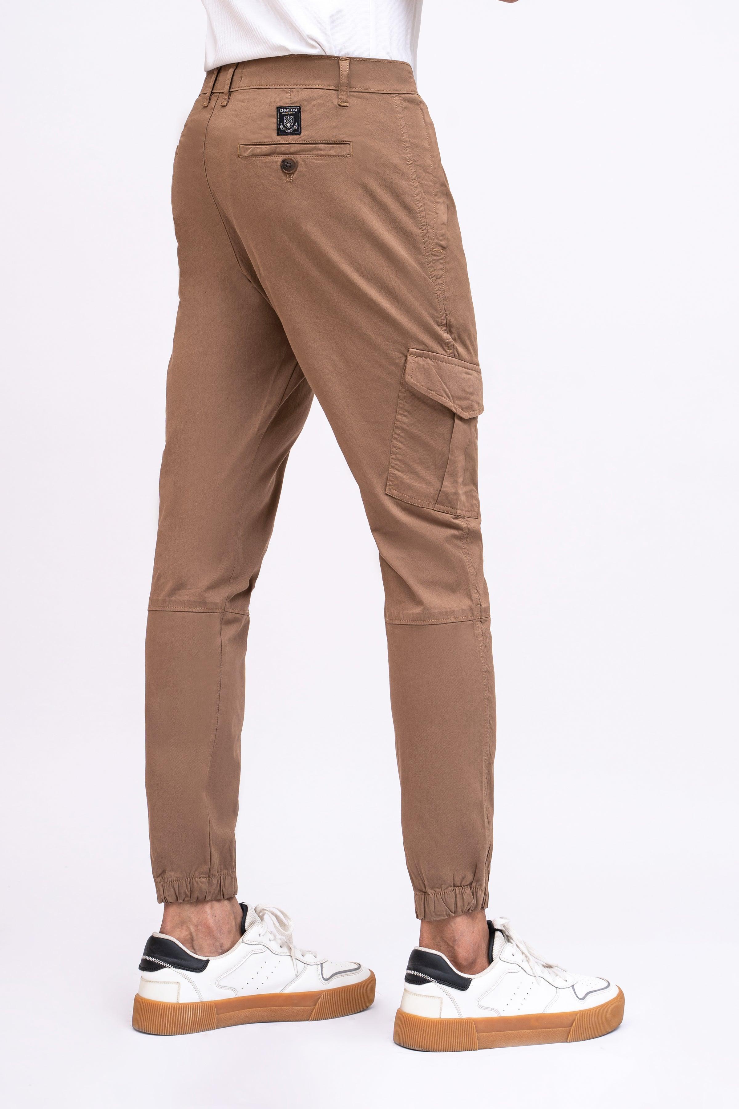 Dark khaki jogger trousers with side cargo pocket and elastic cuff at hem
