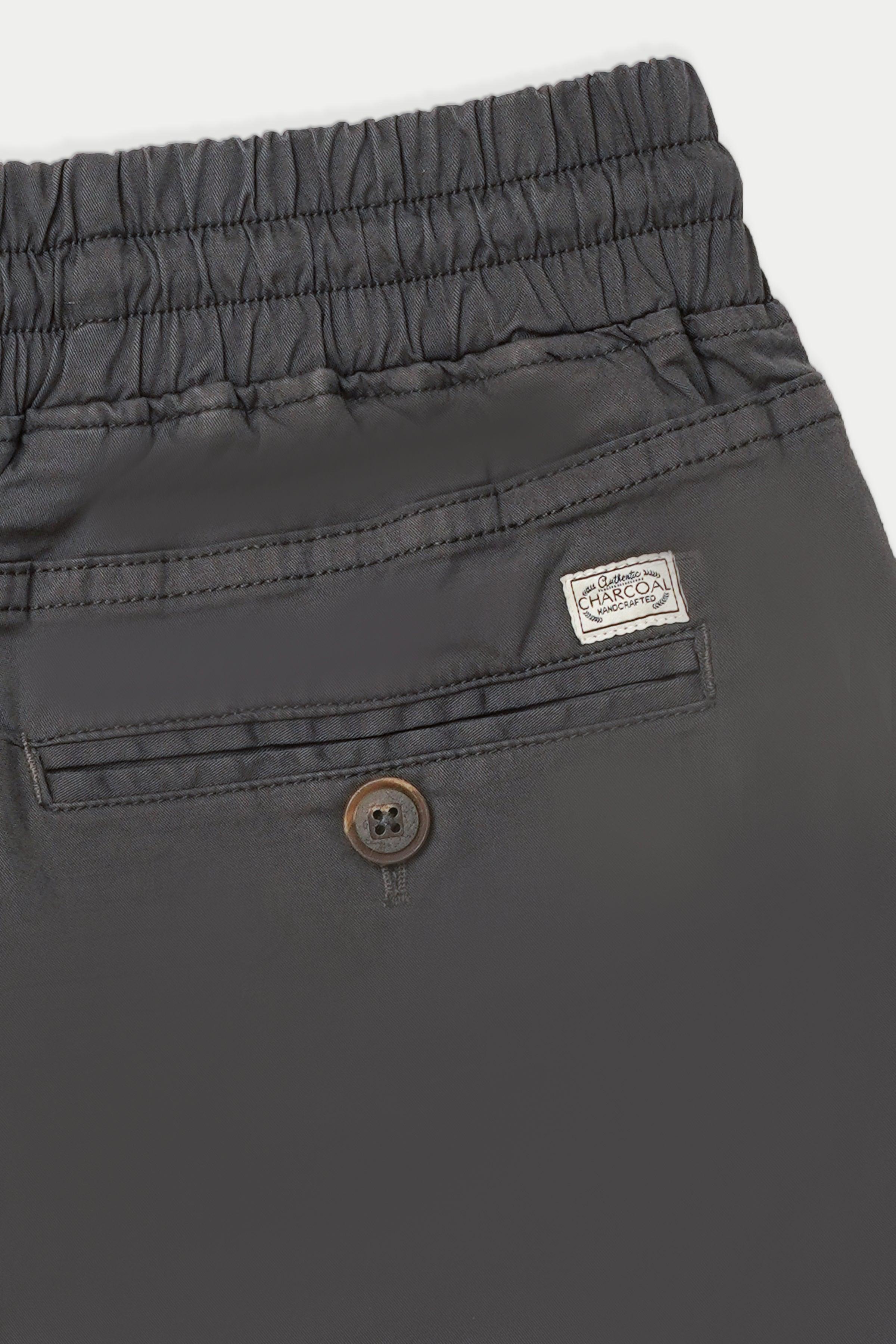 Dark grey jogger trousers waistband with drawstring, button pocket, logo patch