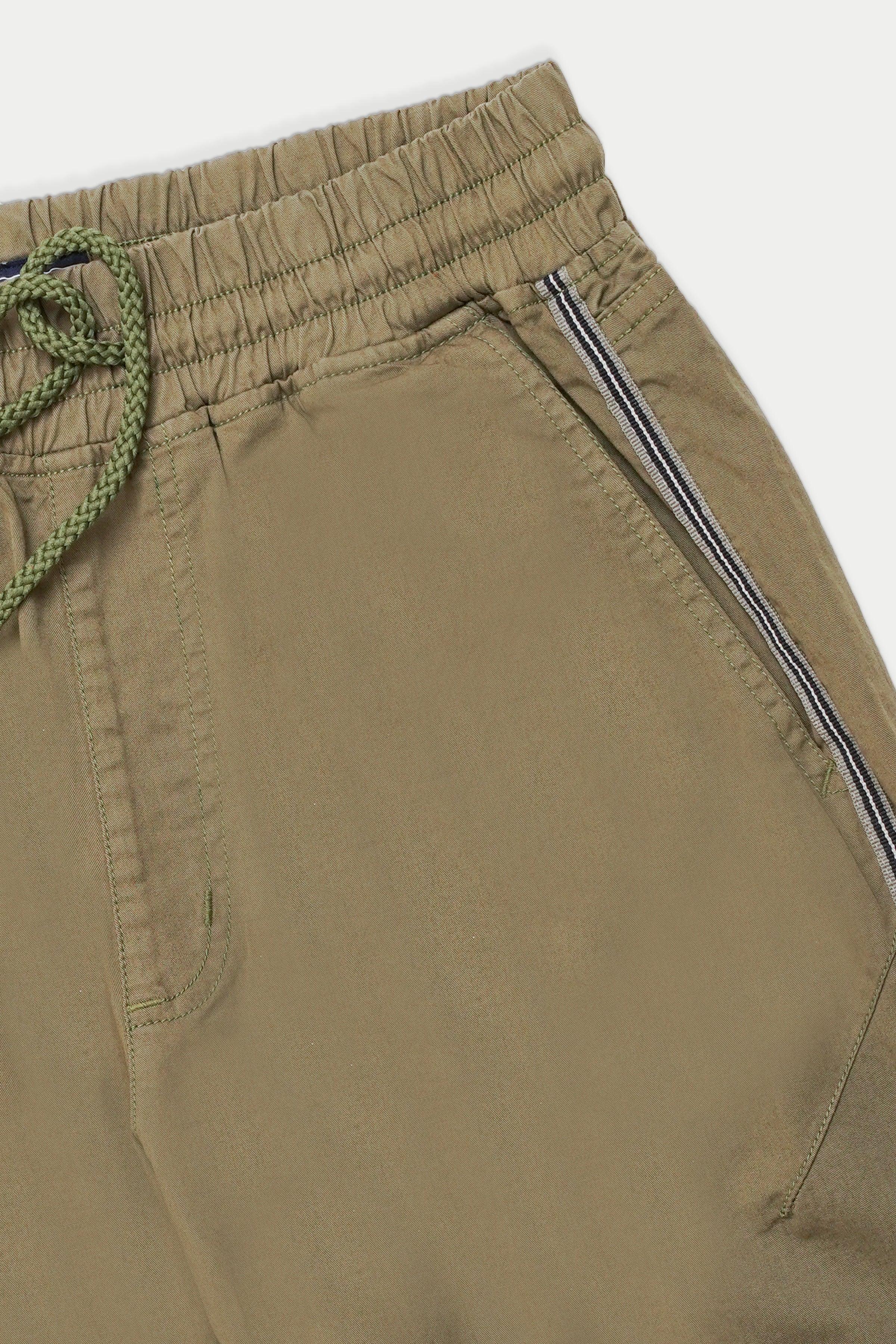 Casual jogger trousers detail: elastic waistband, drawstring, side stripe on leg