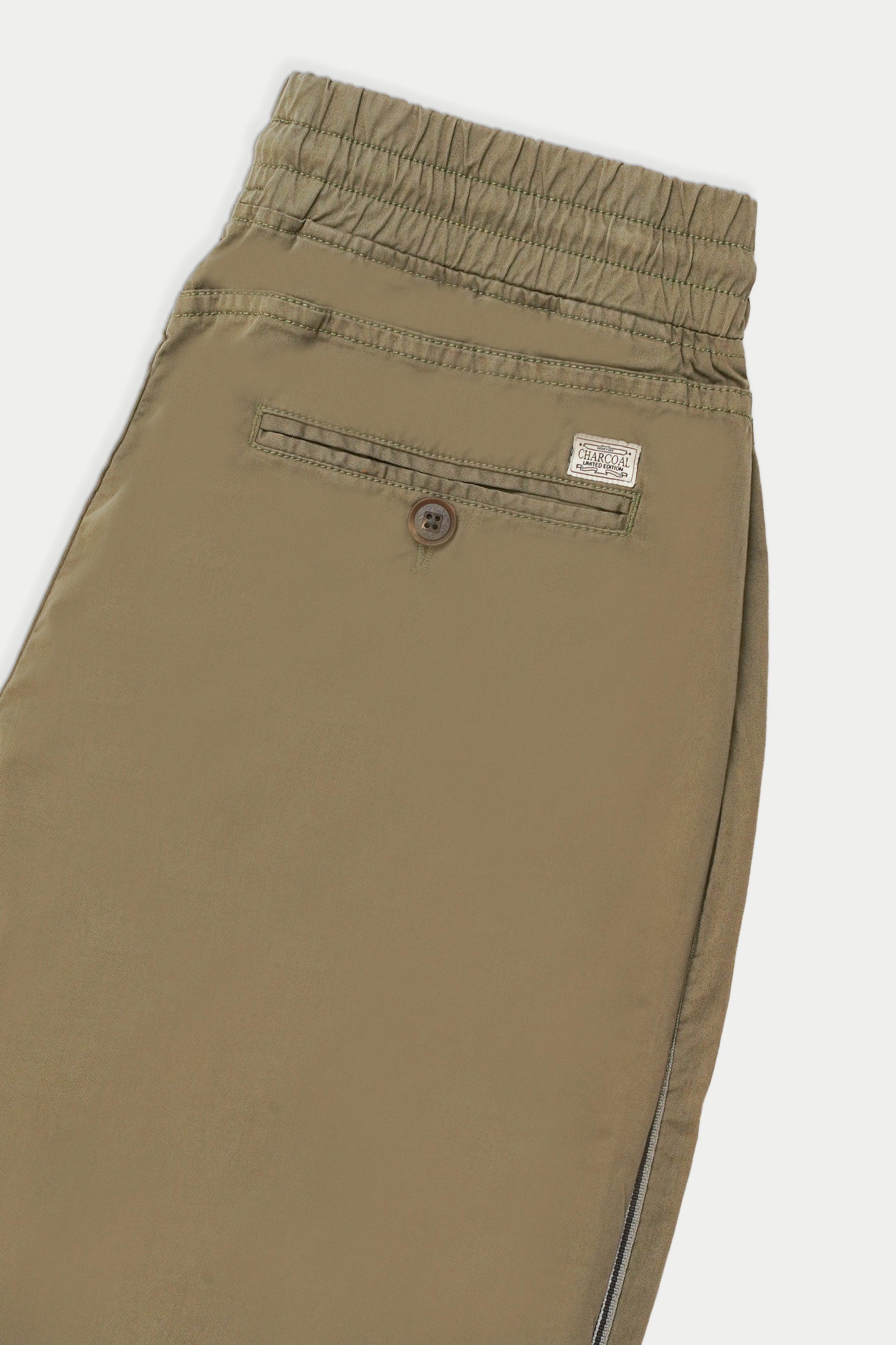 Casual jogger trousers front: button, zip fly, elastic waist, side stripe