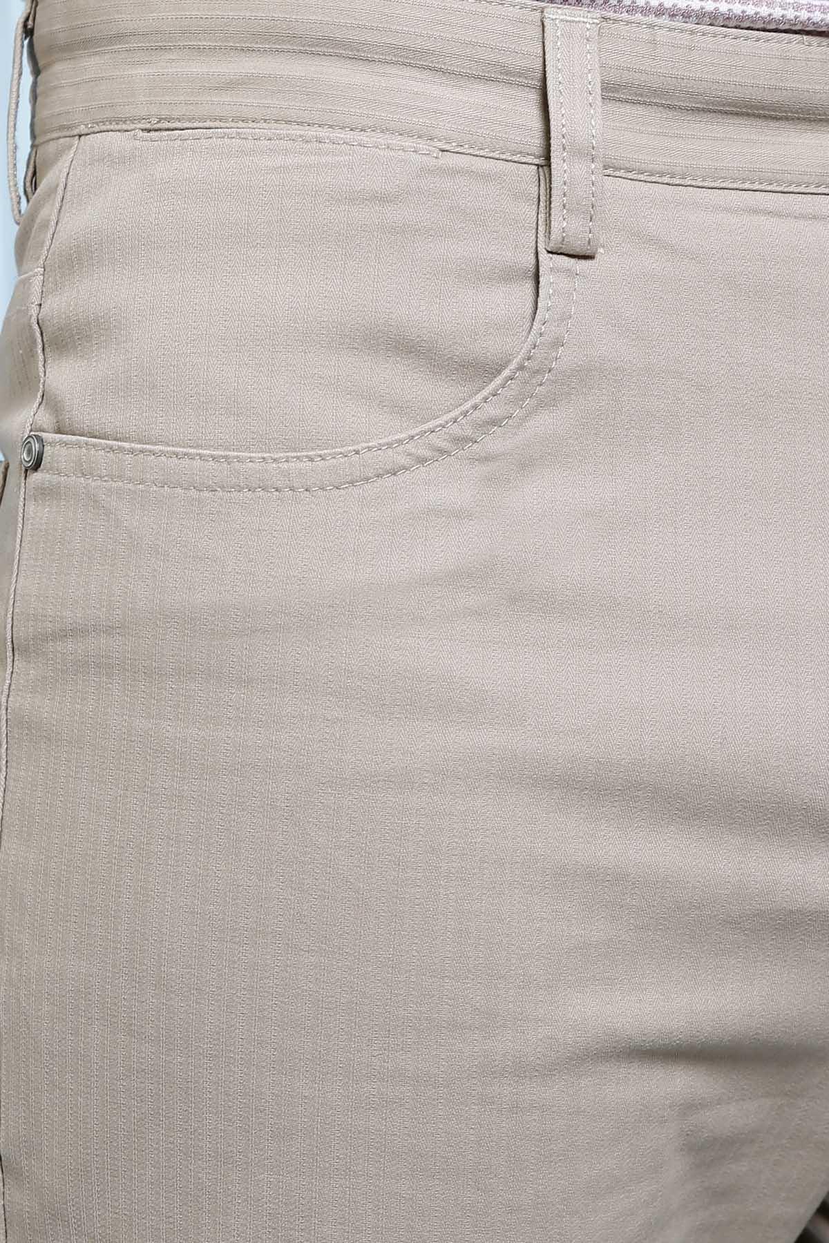 Light brown jeans-style pants with curved front pocket seam stitching