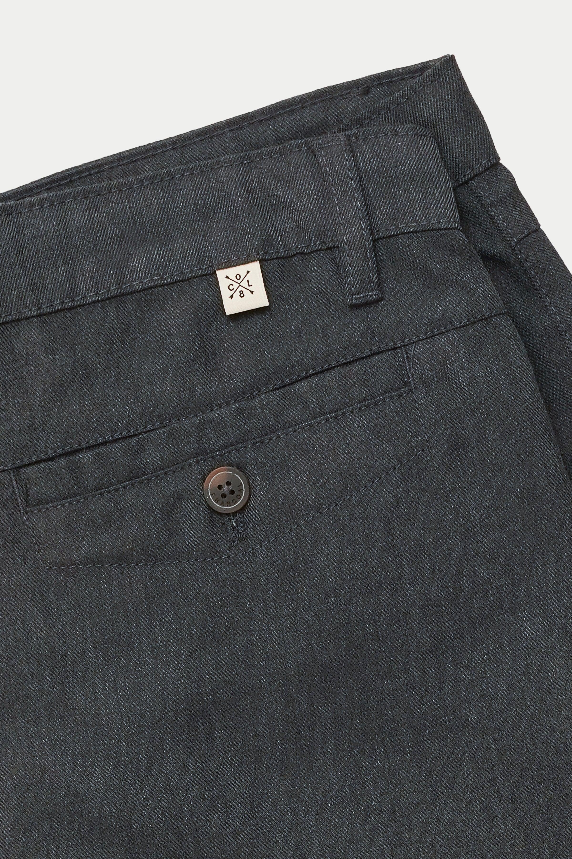 Charcoal casual pants close-up with button fly, belt loops, and side pocket