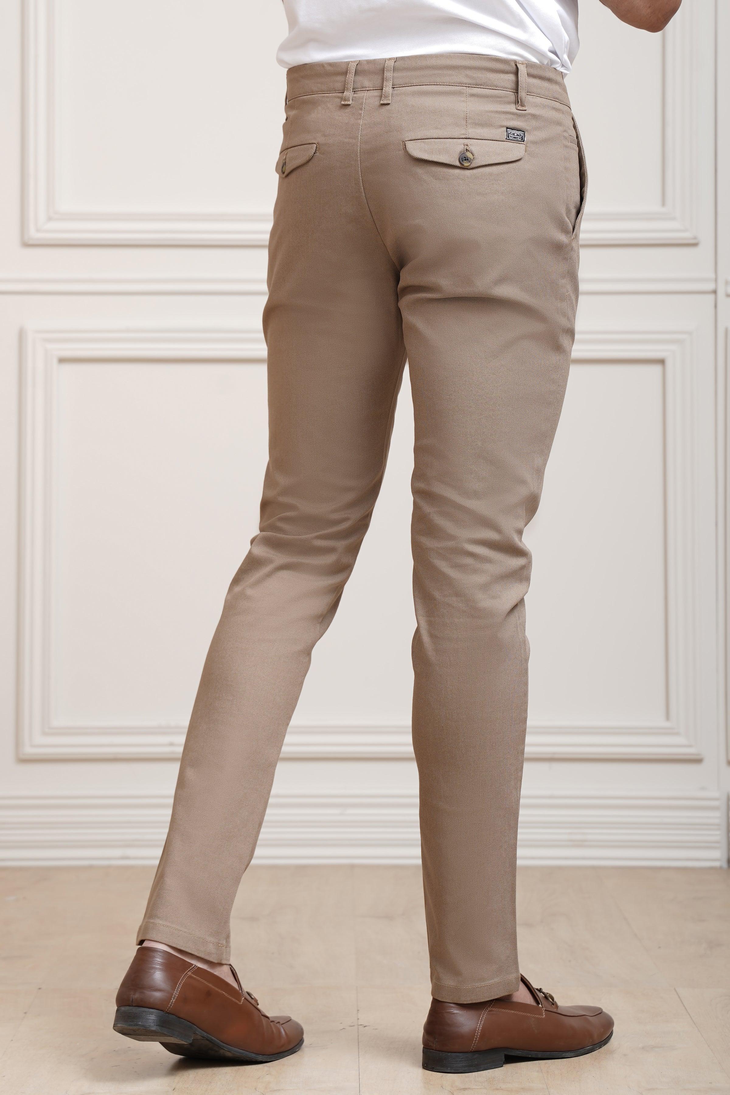 Khaki casual pants with cuffed hem, belt loops, and cross-pocket styling