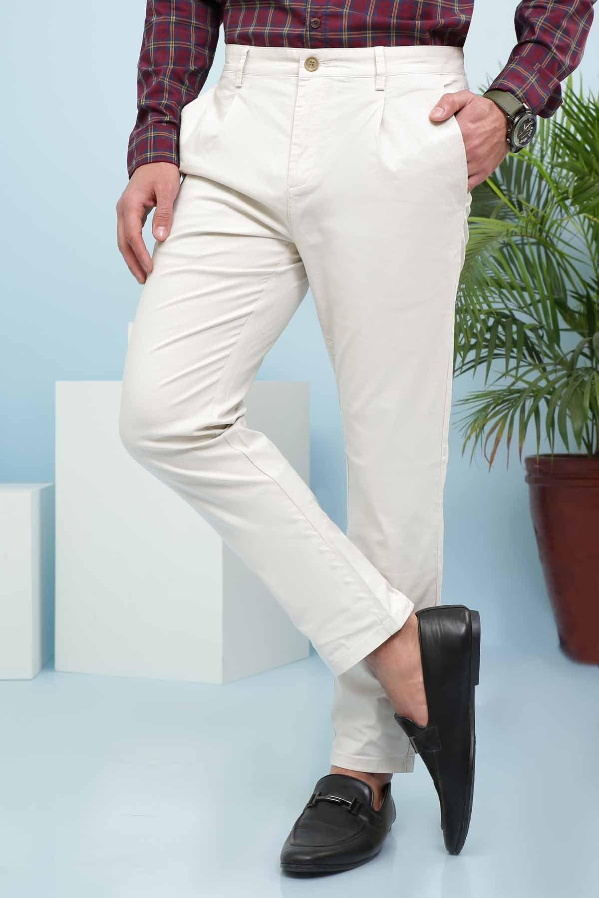 Casual light beige pants with side seam and cuffed hem