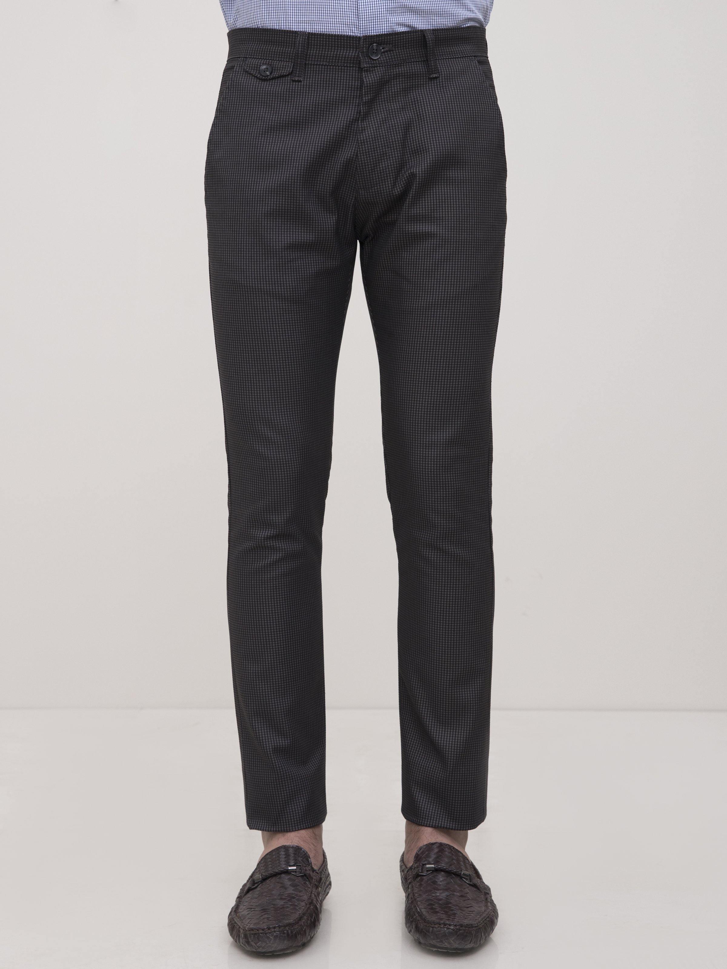 Slim-fit casual pants in black with front button and belt loops