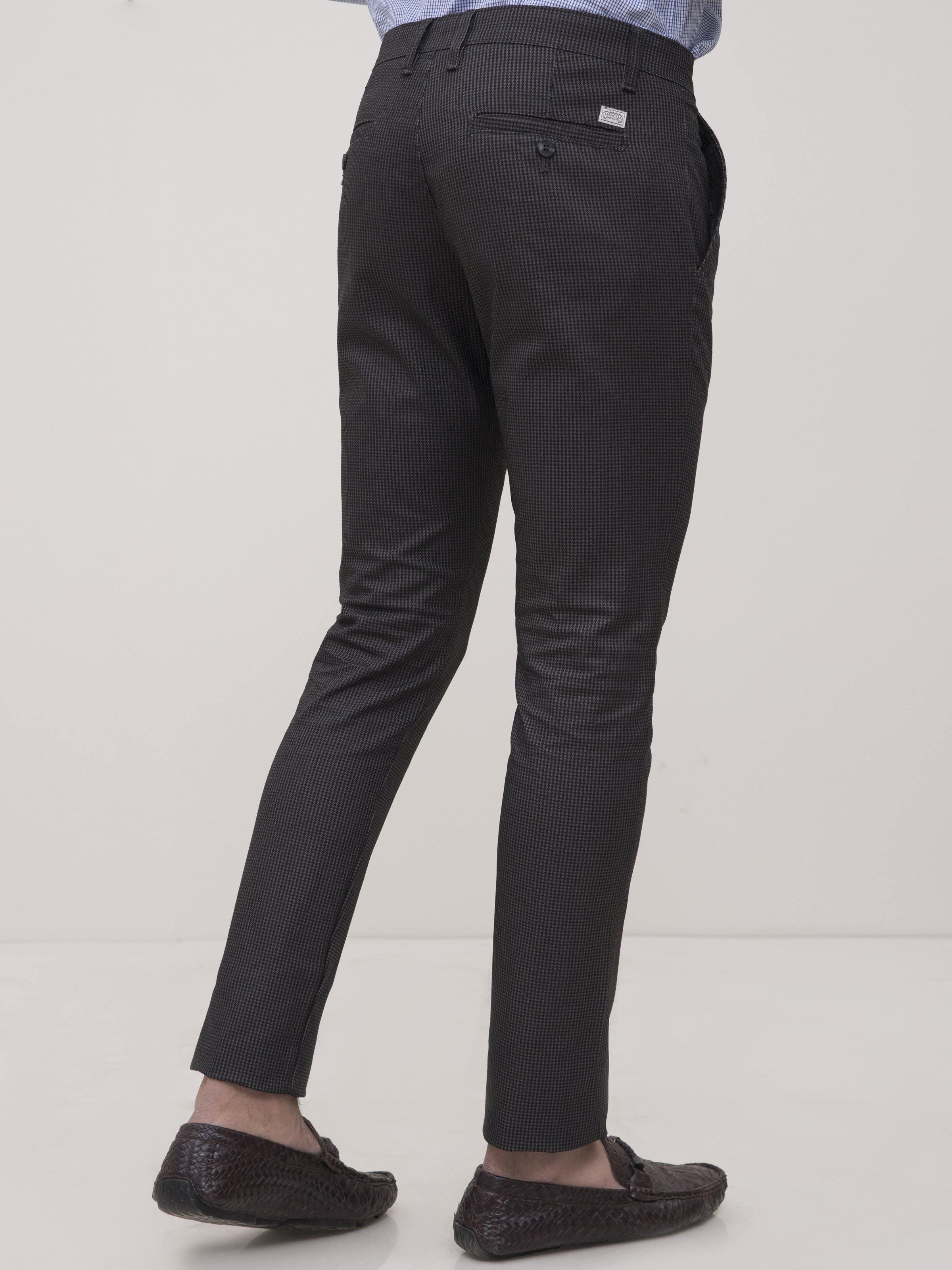 Slim-fit casual pants in black with back yoke and side seam detail