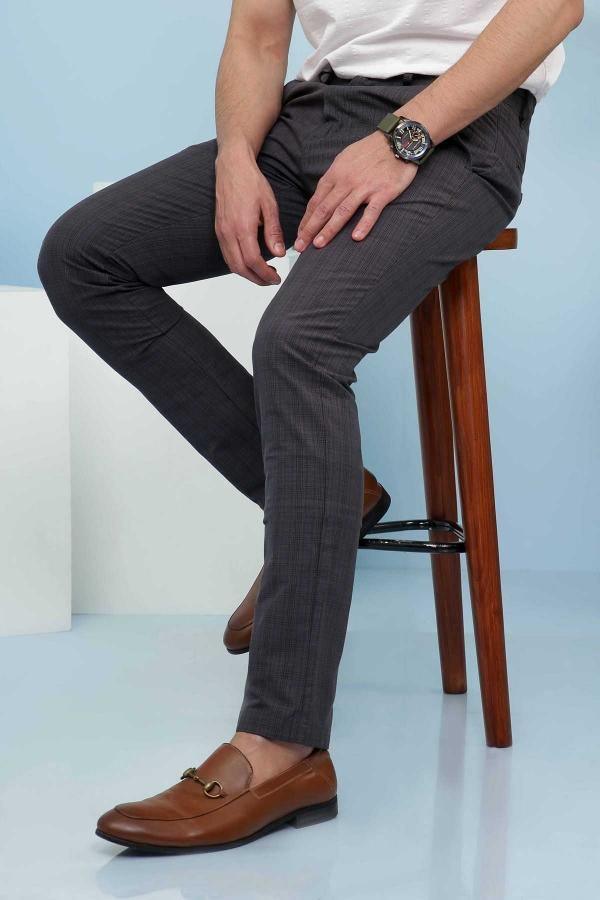 Slim-fit casual pants in dark gray, side view with slim tapered legs and cross pockets