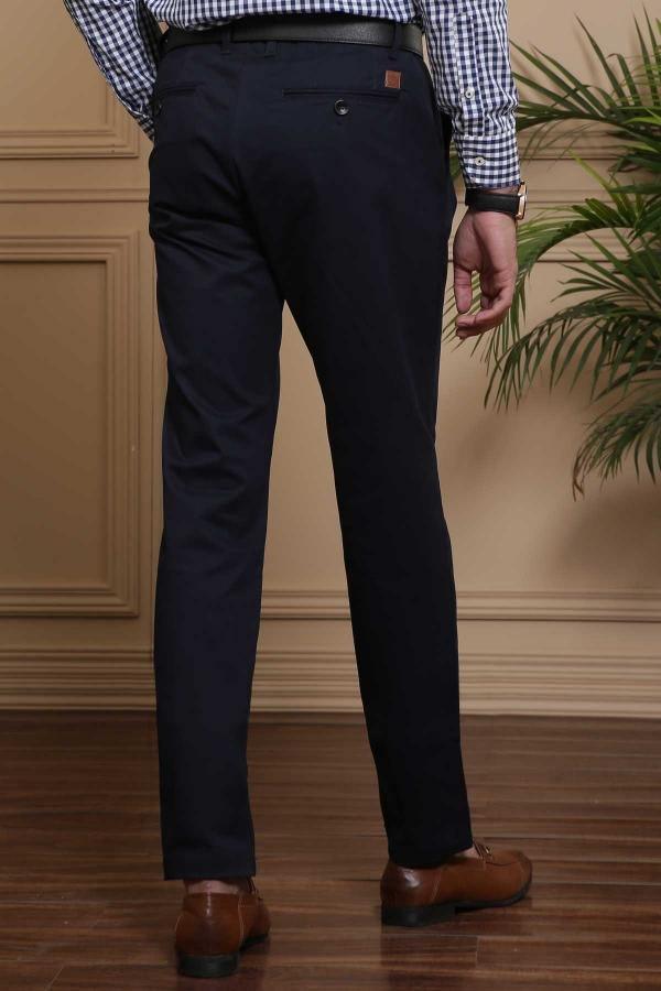 Navy slim-fit casual pants with zip fly, belt loops, and tapered legs