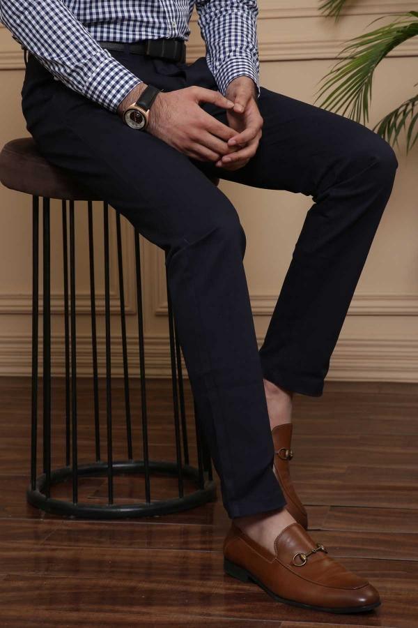 Navy slim-fit casual pants with front crease, side pockets, and tapered hem
