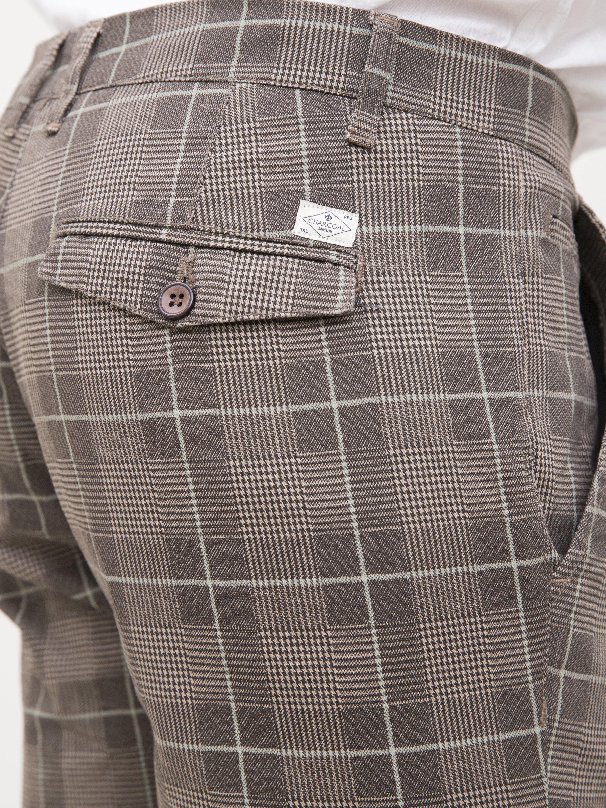 Plaid flap pocket with button detail on slim-fit pants, khaki brown