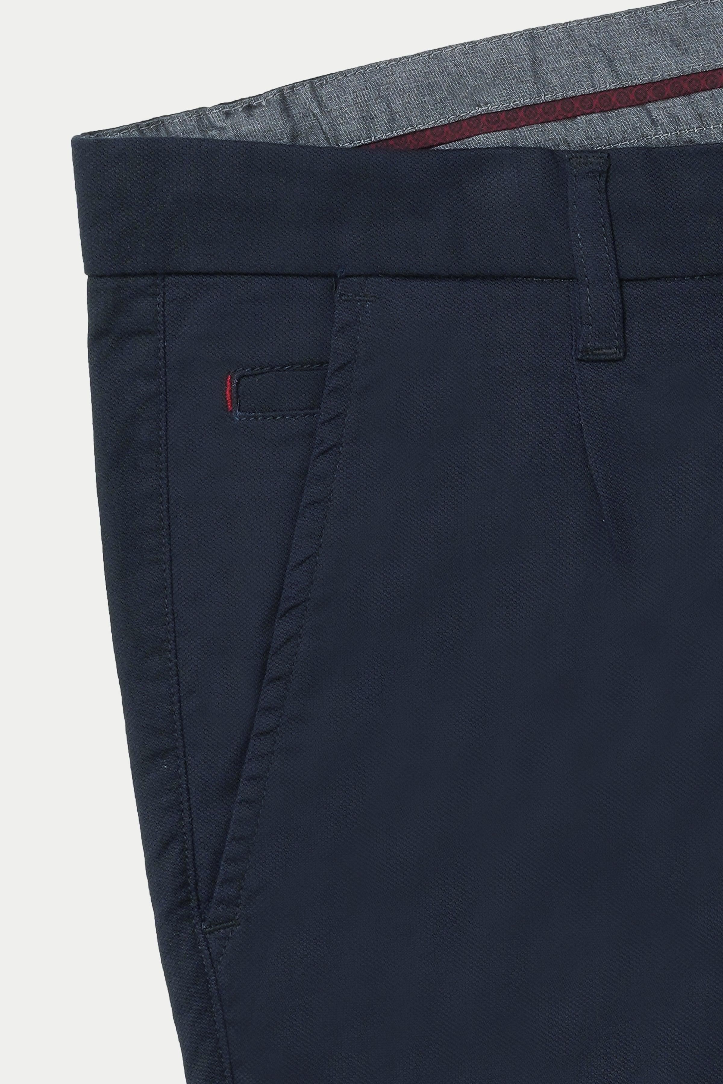 Navy casual pants with side pocket and stitch detailing at waistband