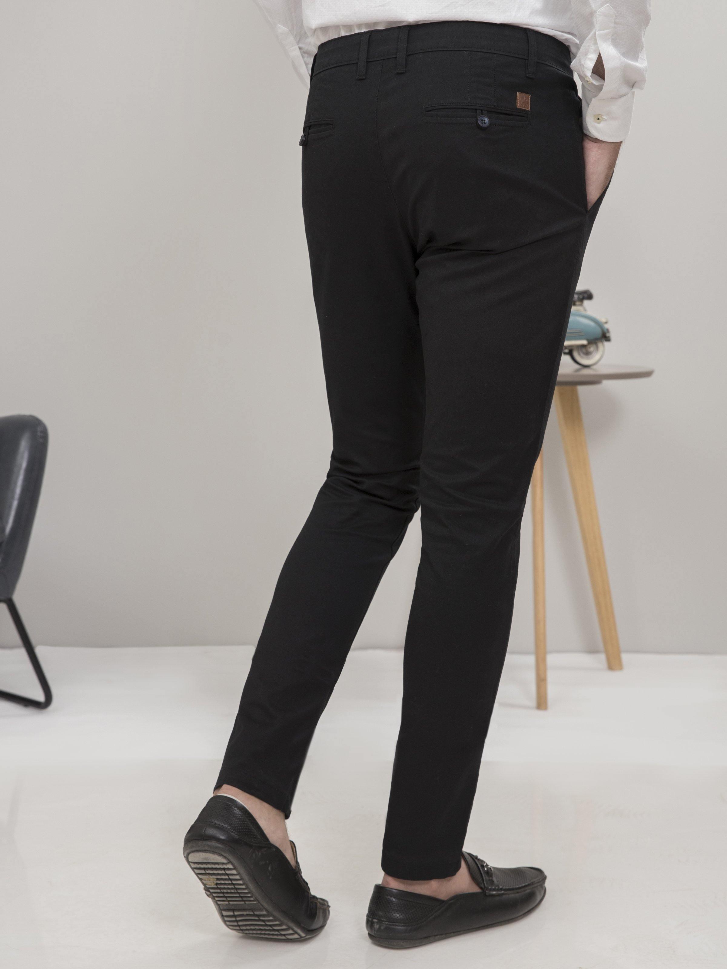 Black slim-fit casual pants with back pocket and tapered leg cuffs