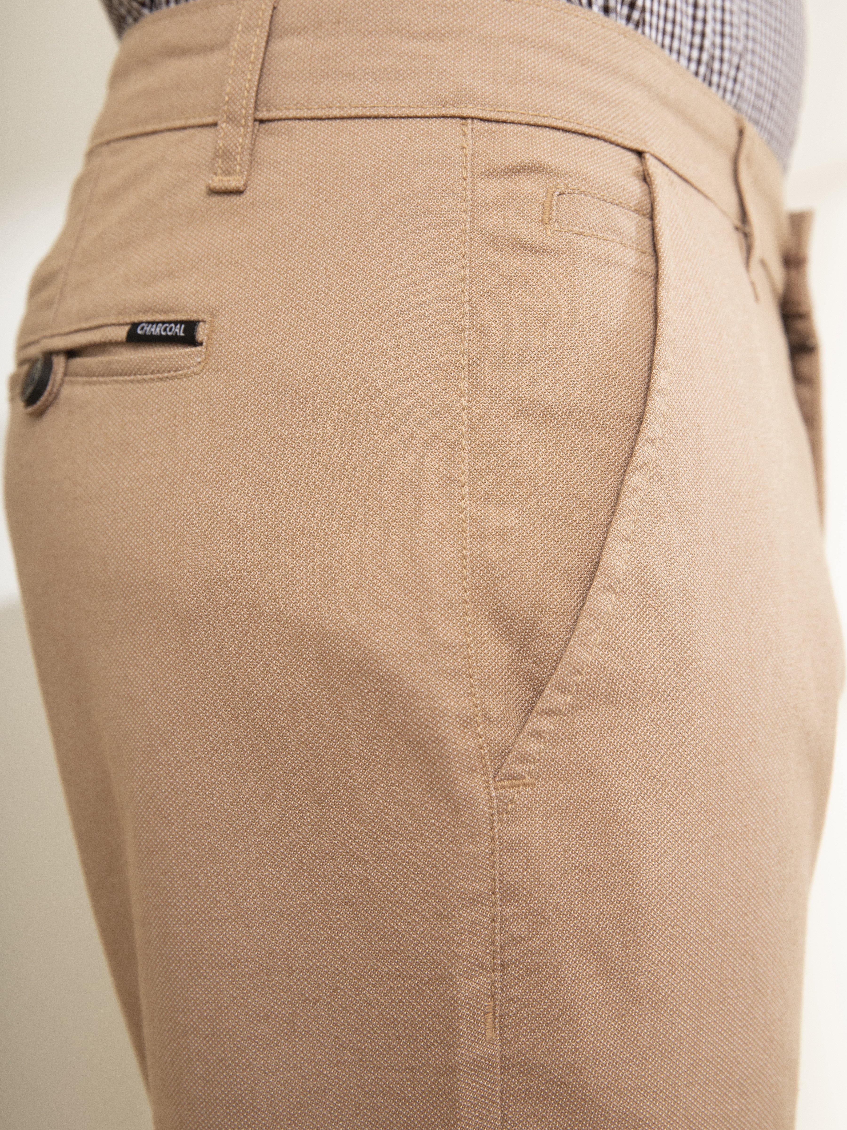 Khaki pants back with welt pocket and stitched seam detail