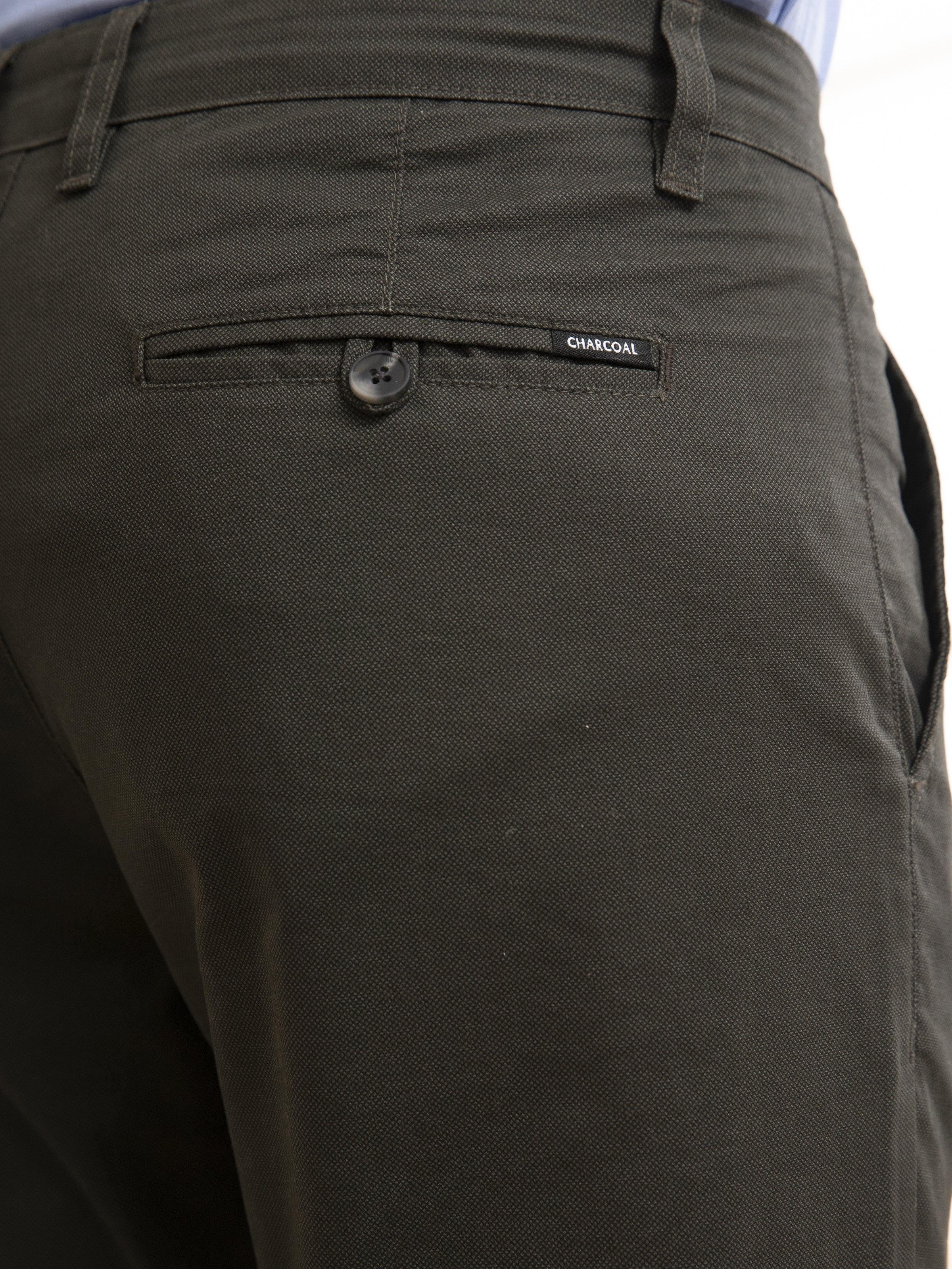 Olive front waistband with button closure and inner pocket label