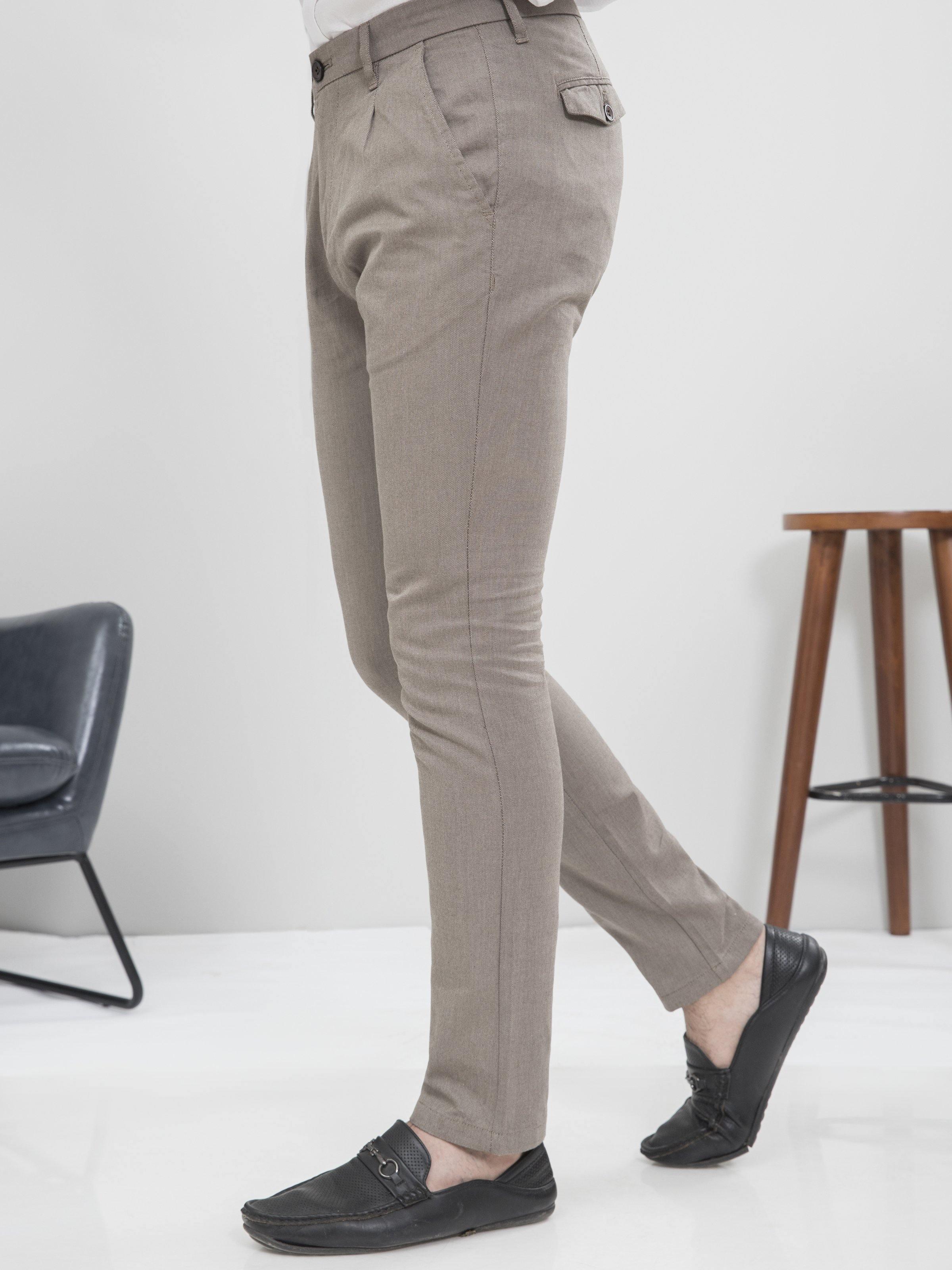 Light brown slim-fit casual pants with front button, belt loops, and side pockets