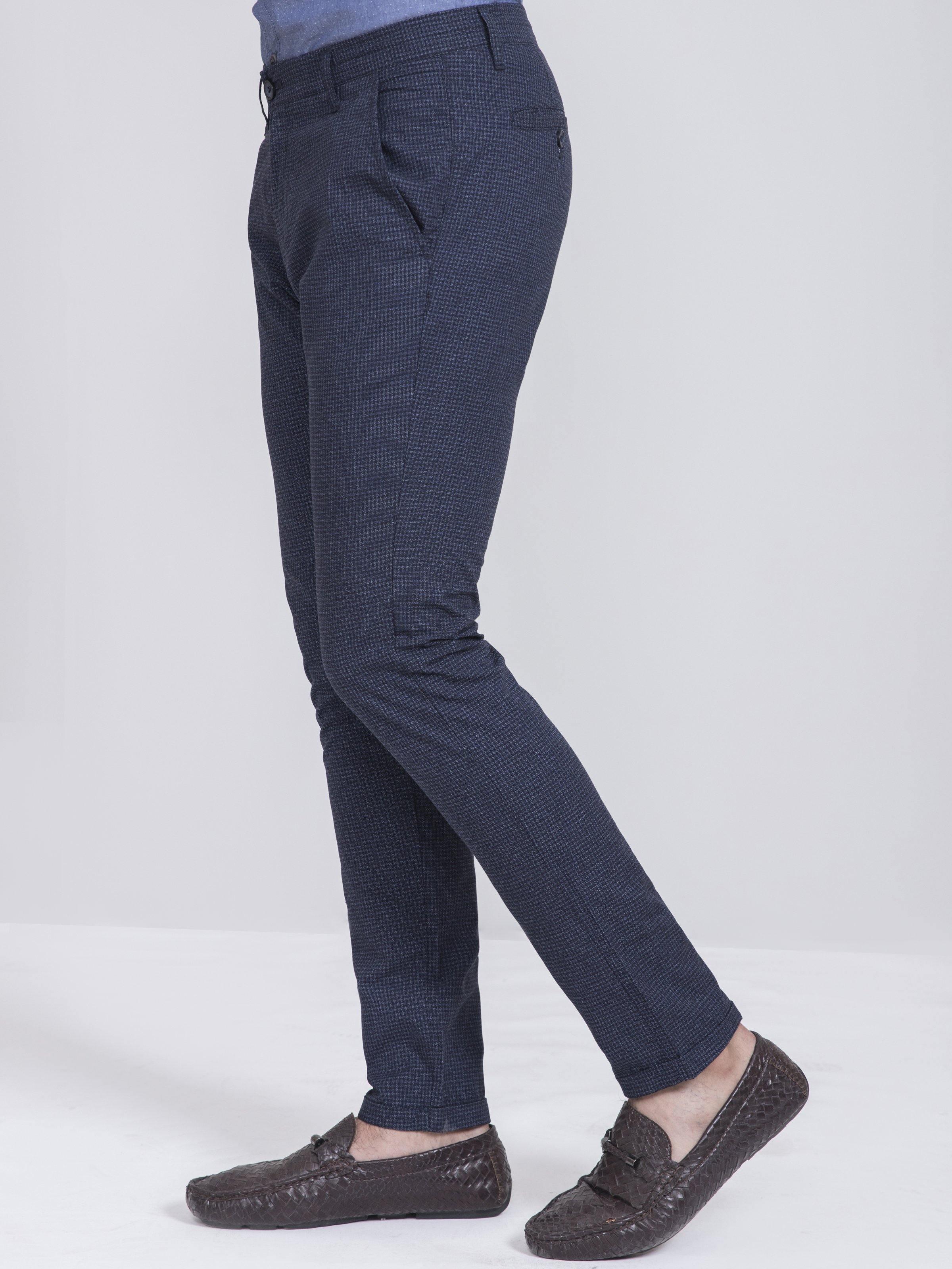 Slim-fit casual pants in dark navy with subtle check, side view, cuffed ankle