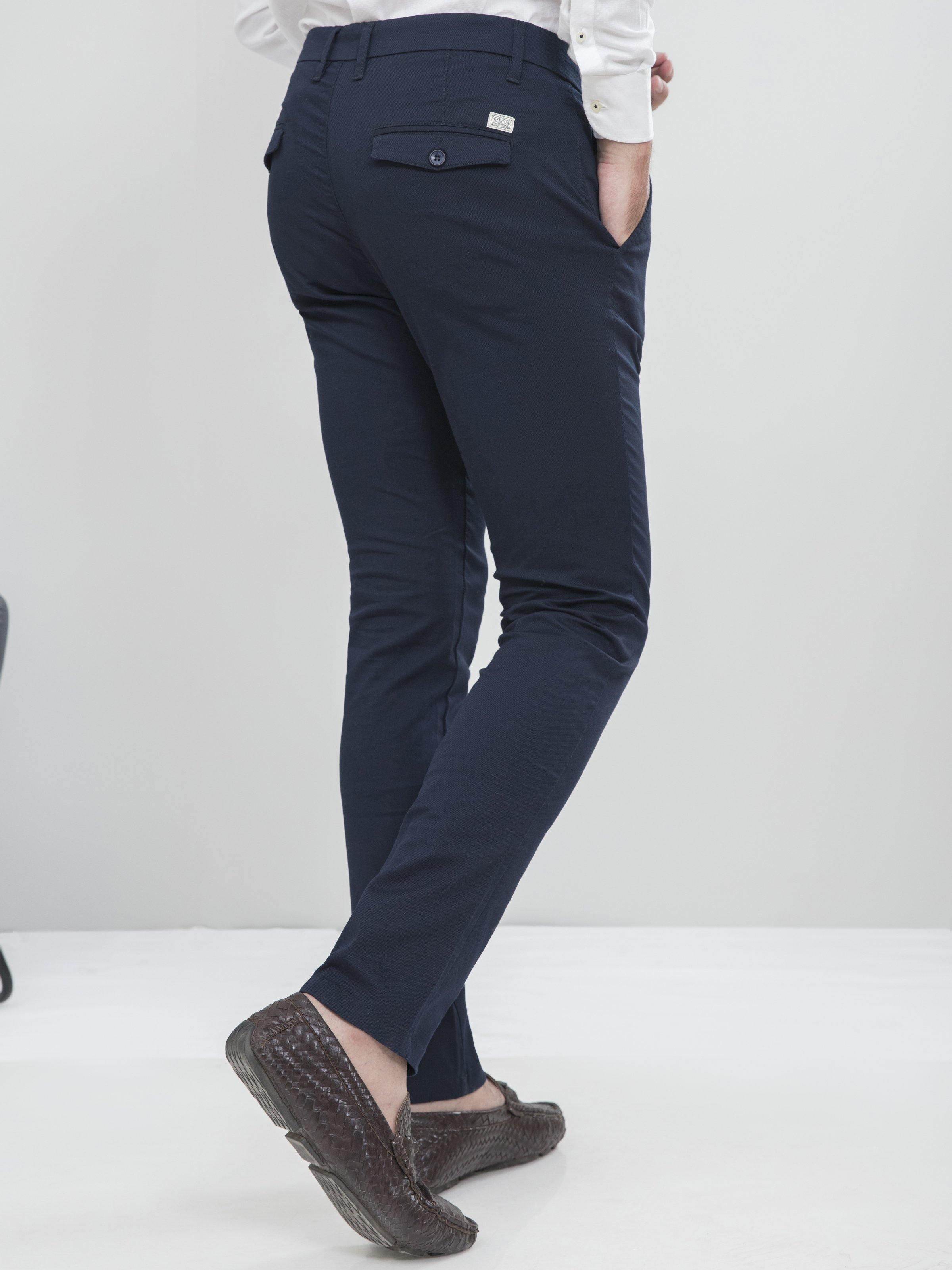 Navy slim-fit casual pants with back yoke, rear pockets, and belt loops