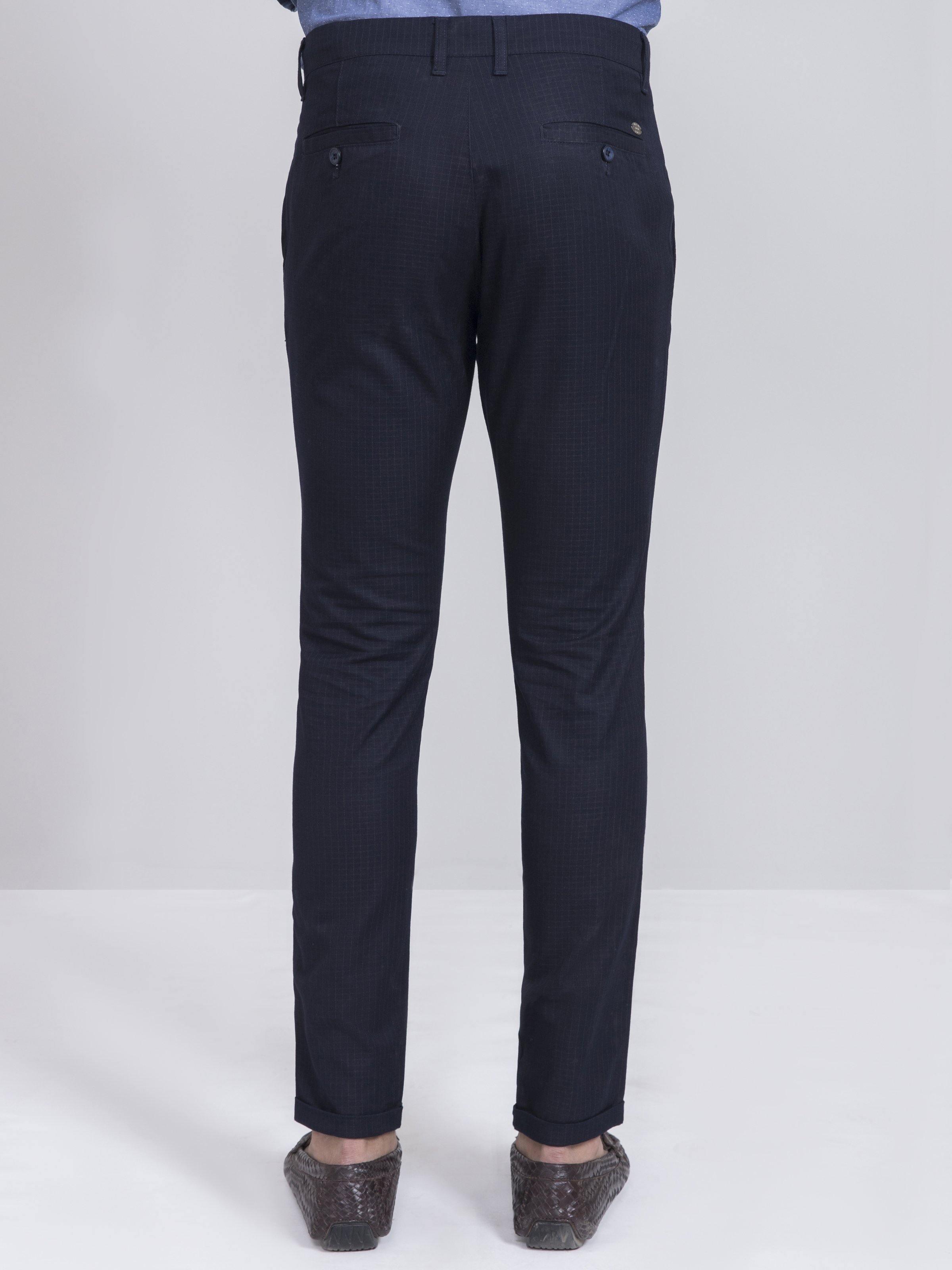 Navy slim-fit casual pants with back pockets and tapered ankles.