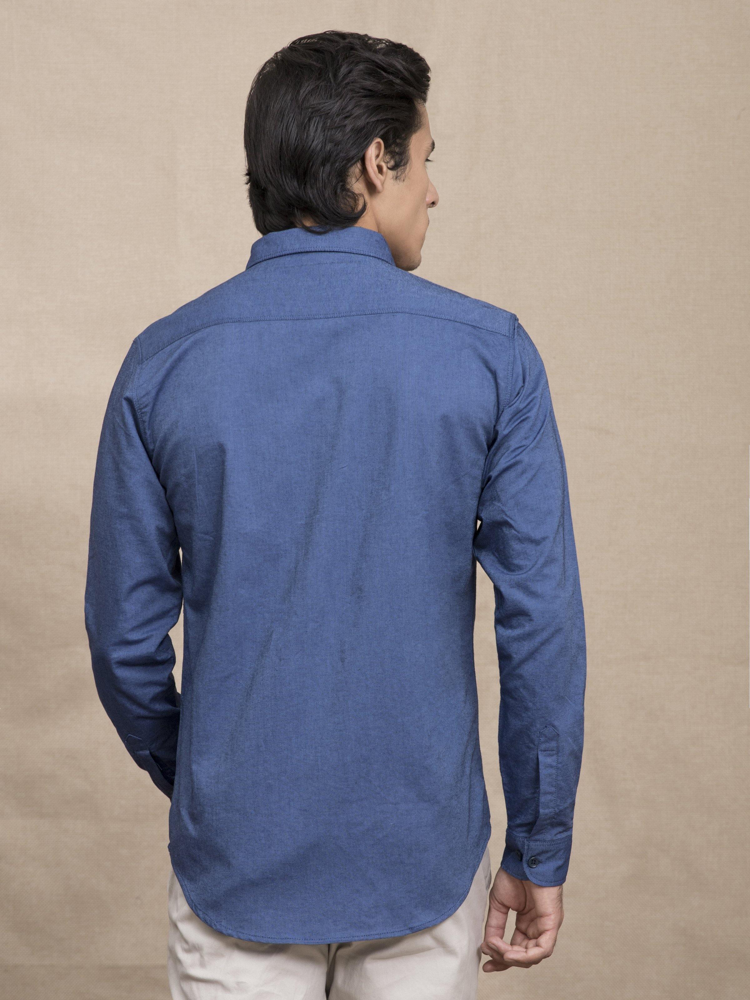 Blue button-down casual shirt with long sleeves, back view and center seam