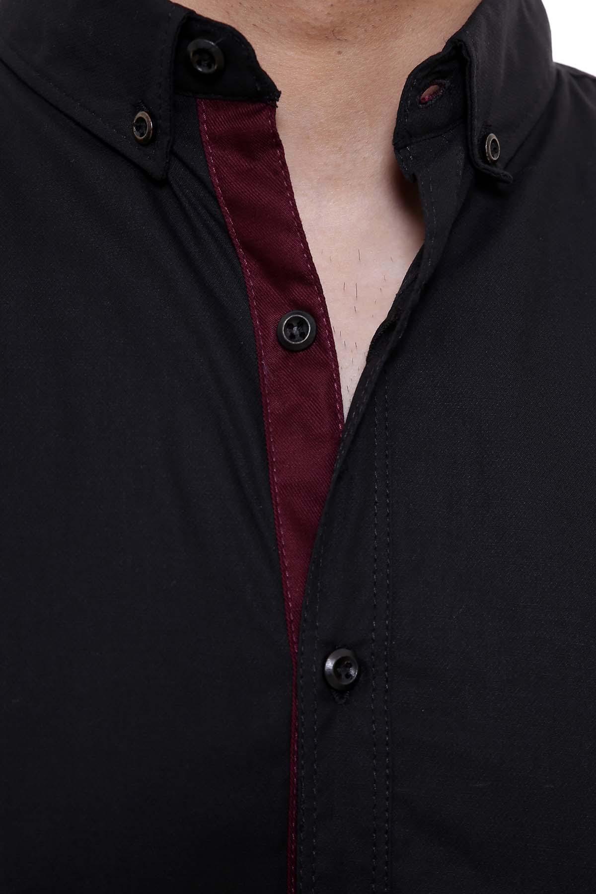 Black button-up shirt close-up with open placket, dark buttons, and maroon inner trim.