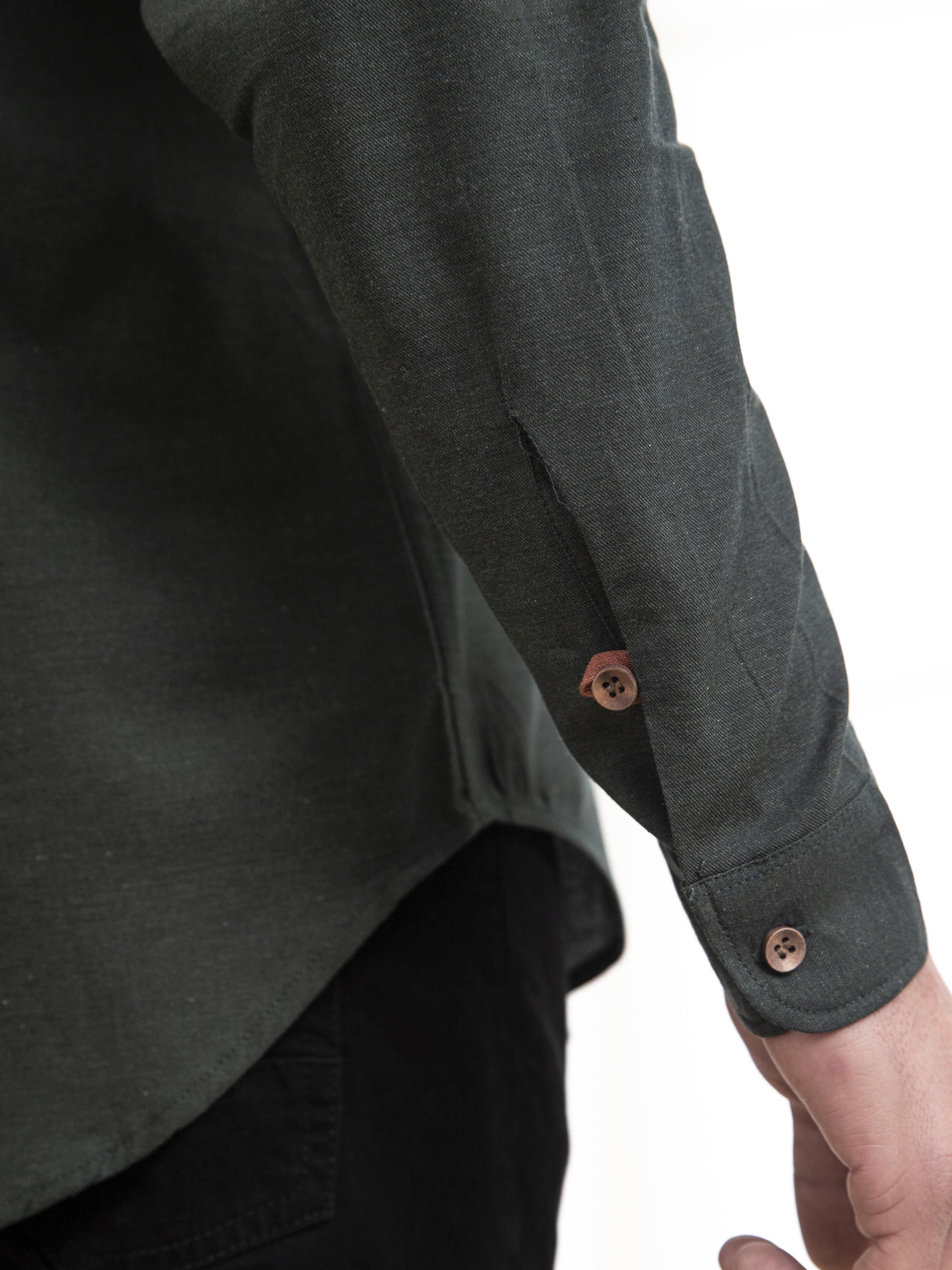 Men's casual dark green full-sleeve shirt cuff with brown buttons