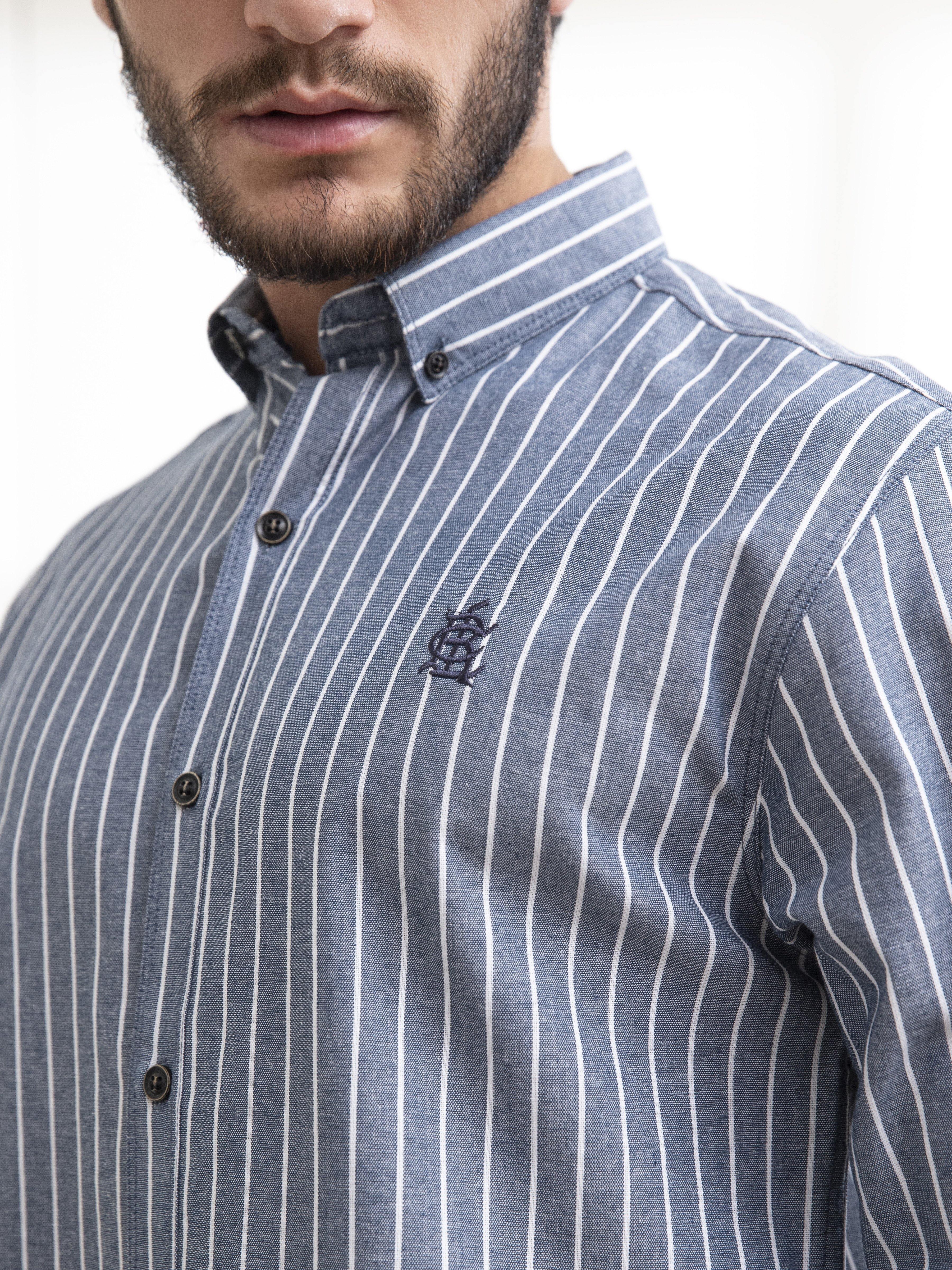 Grey striped shirt close-up with button placket, stand collar and chest emblem