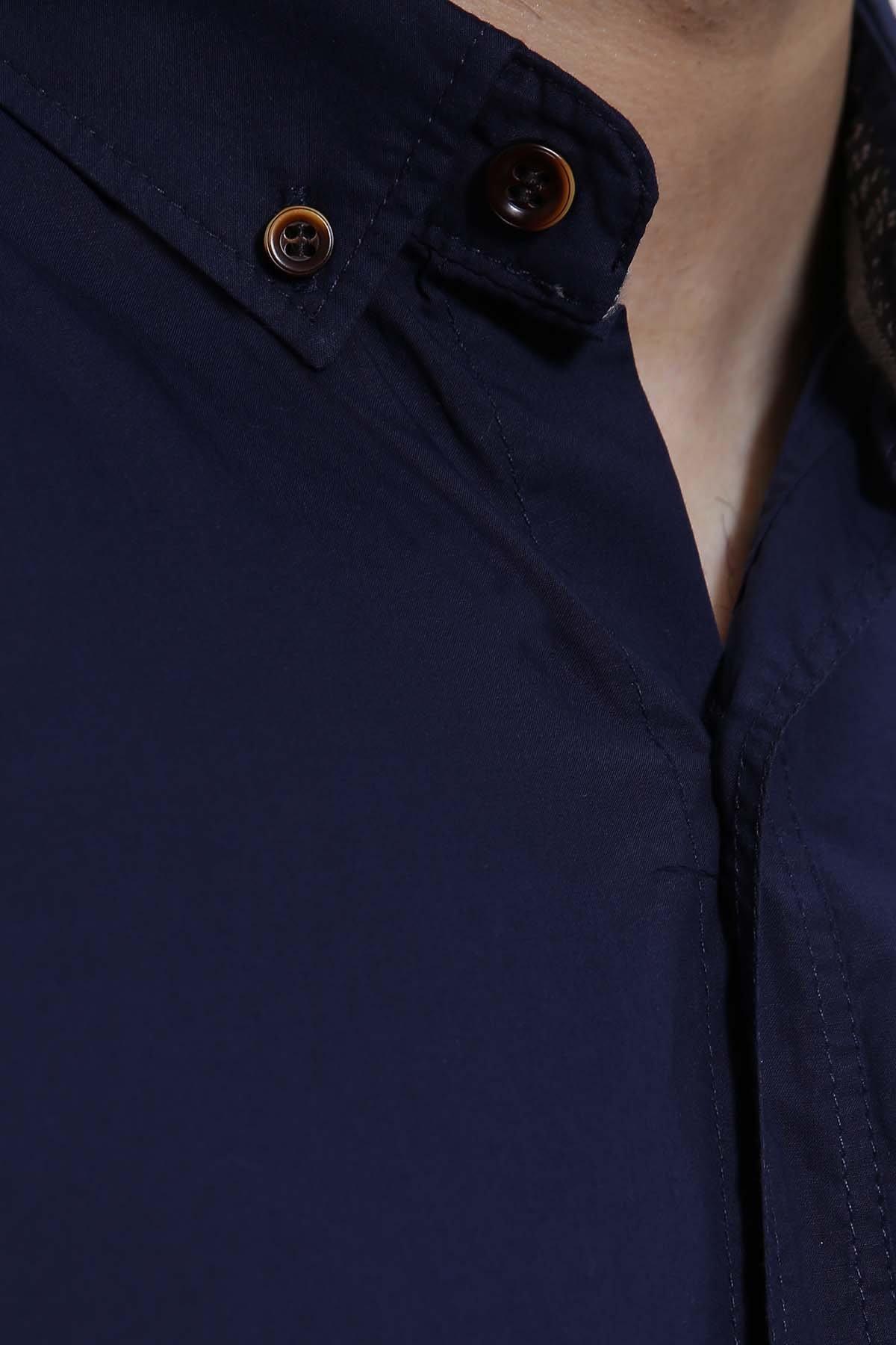 Navy button-up shirt with brown buttons and spread collar detail