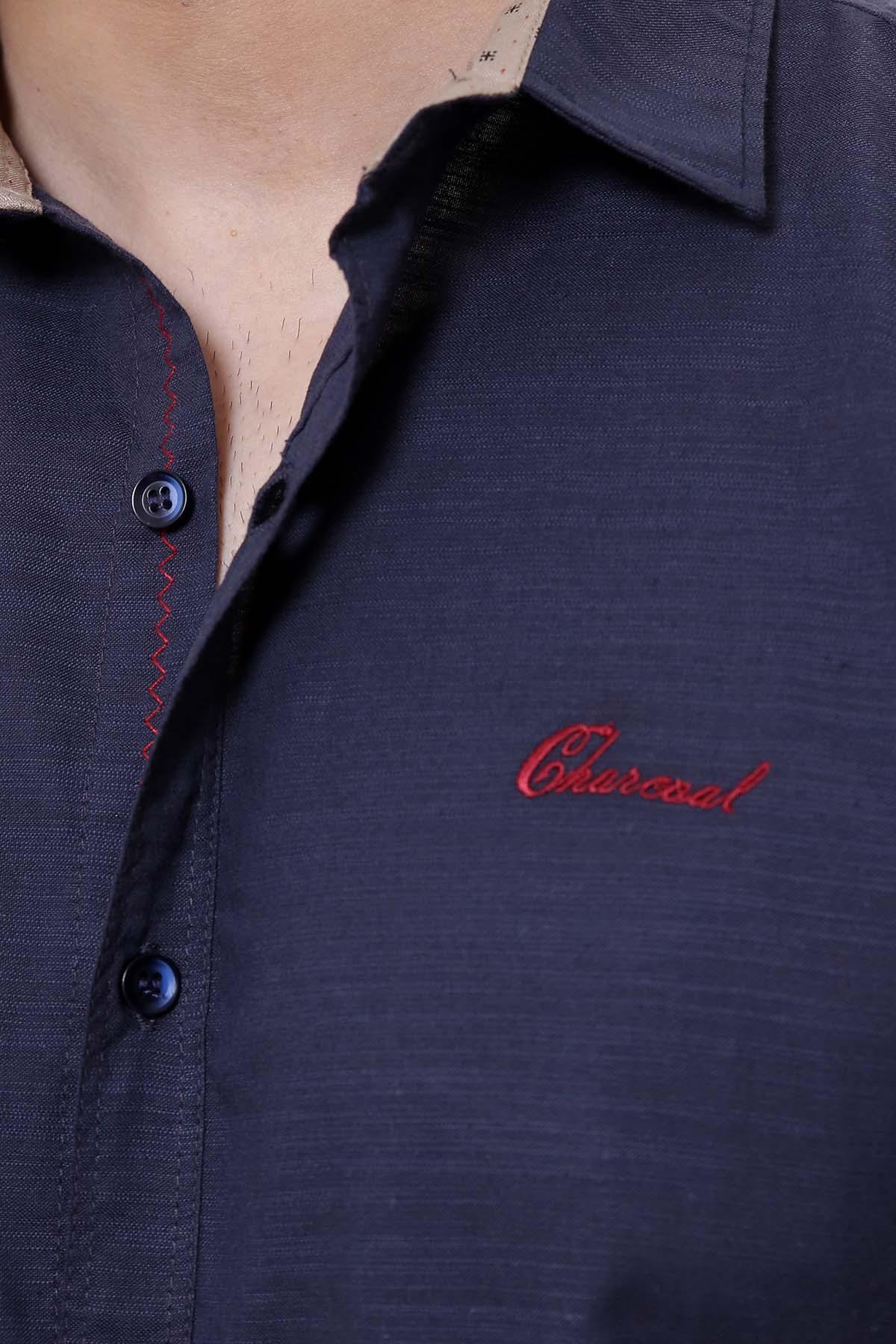 Navy casual shirt close-up showing chest logo and button placket