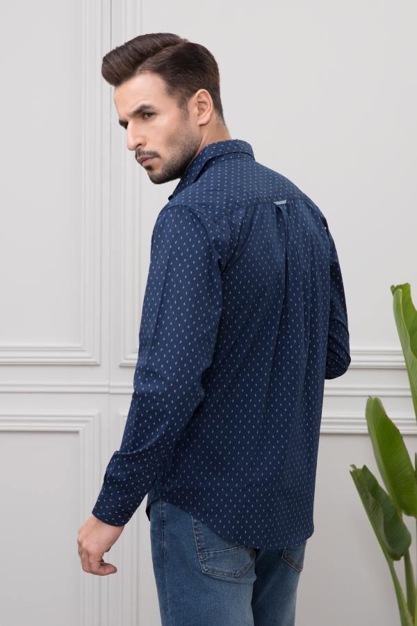 Navy long-sleeve casual shirt, side view with buttoned cuffs and dotted print.