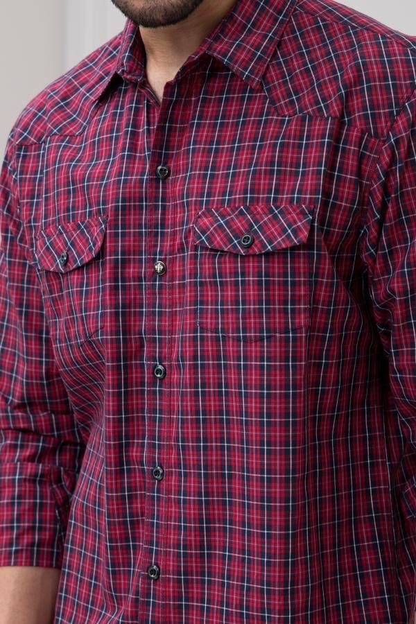 Red plaid full-sleeve shirt close-up, button placket and chest pocket